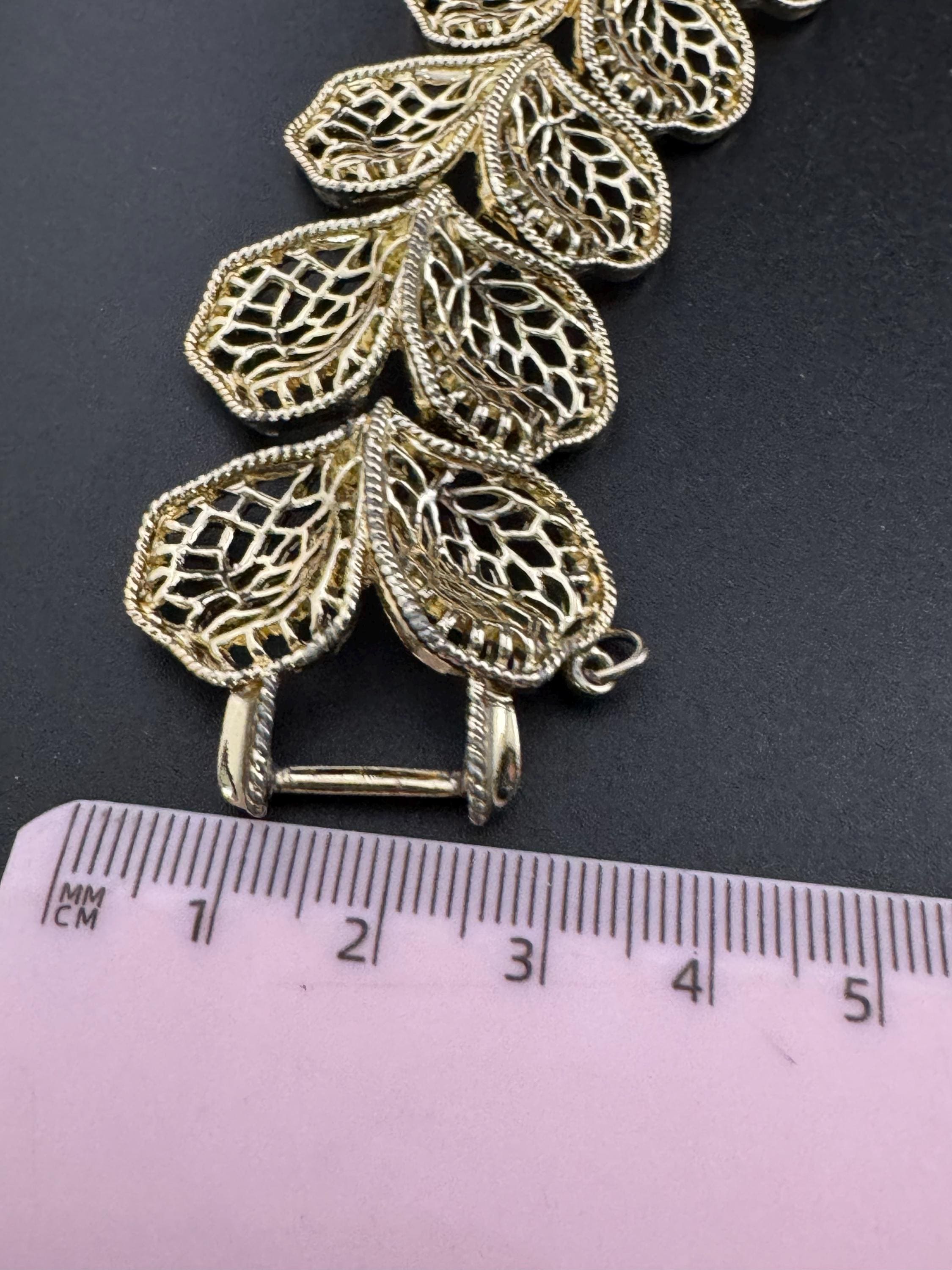 Mid century vintage very wide gold tone floral leaf bracelet,  panel link openwork with safety chain