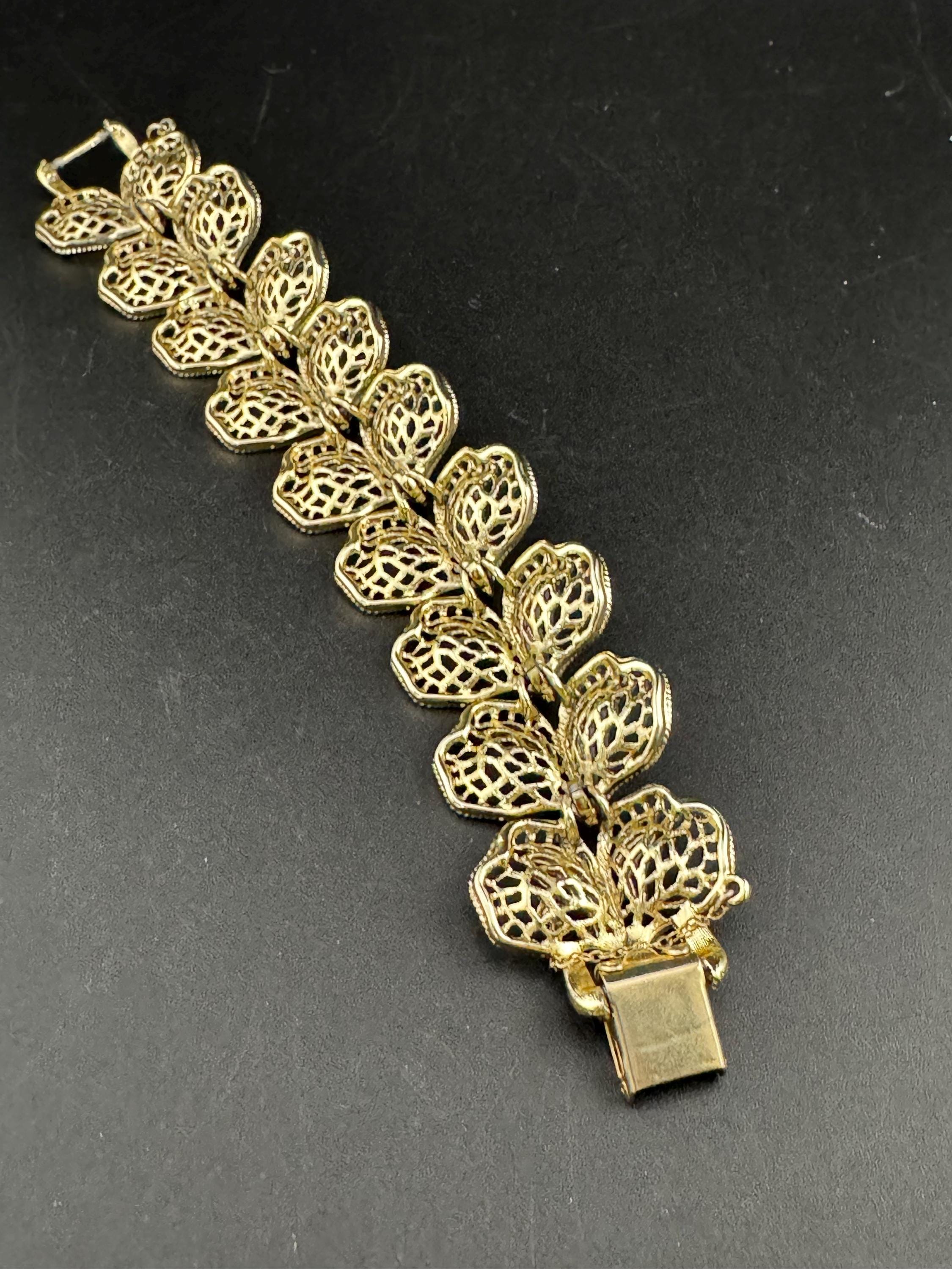 Mid century vintage very wide gold tone floral leaf bracelet,  panel link openwork with safety chain