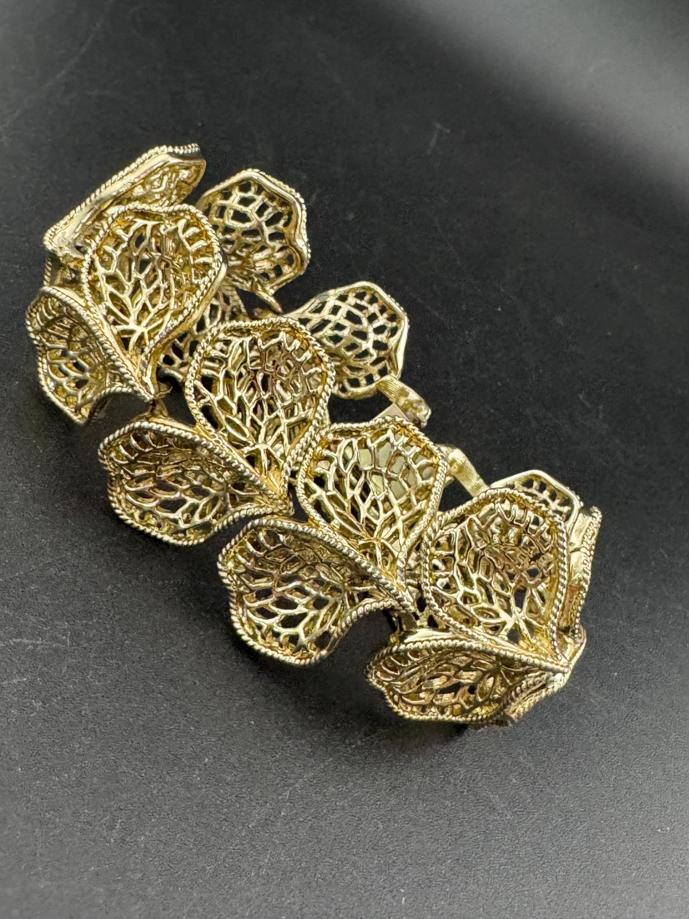 Mid century vintage very wide gold tone floral leaf bracelet,  panel link openwork with safety chain