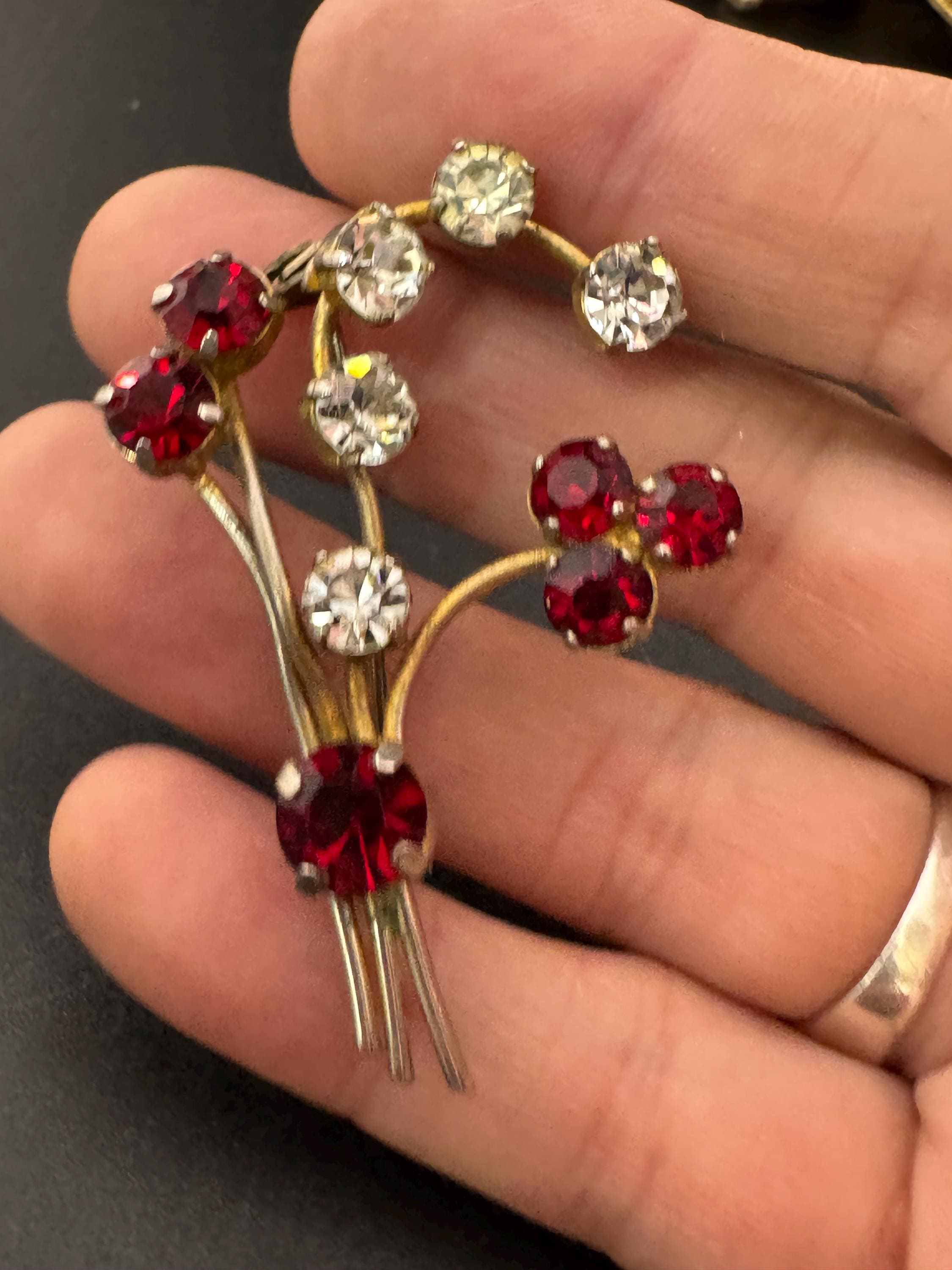 Vintage ruby red glass rhinestone gold tone floral brooch , mid century
