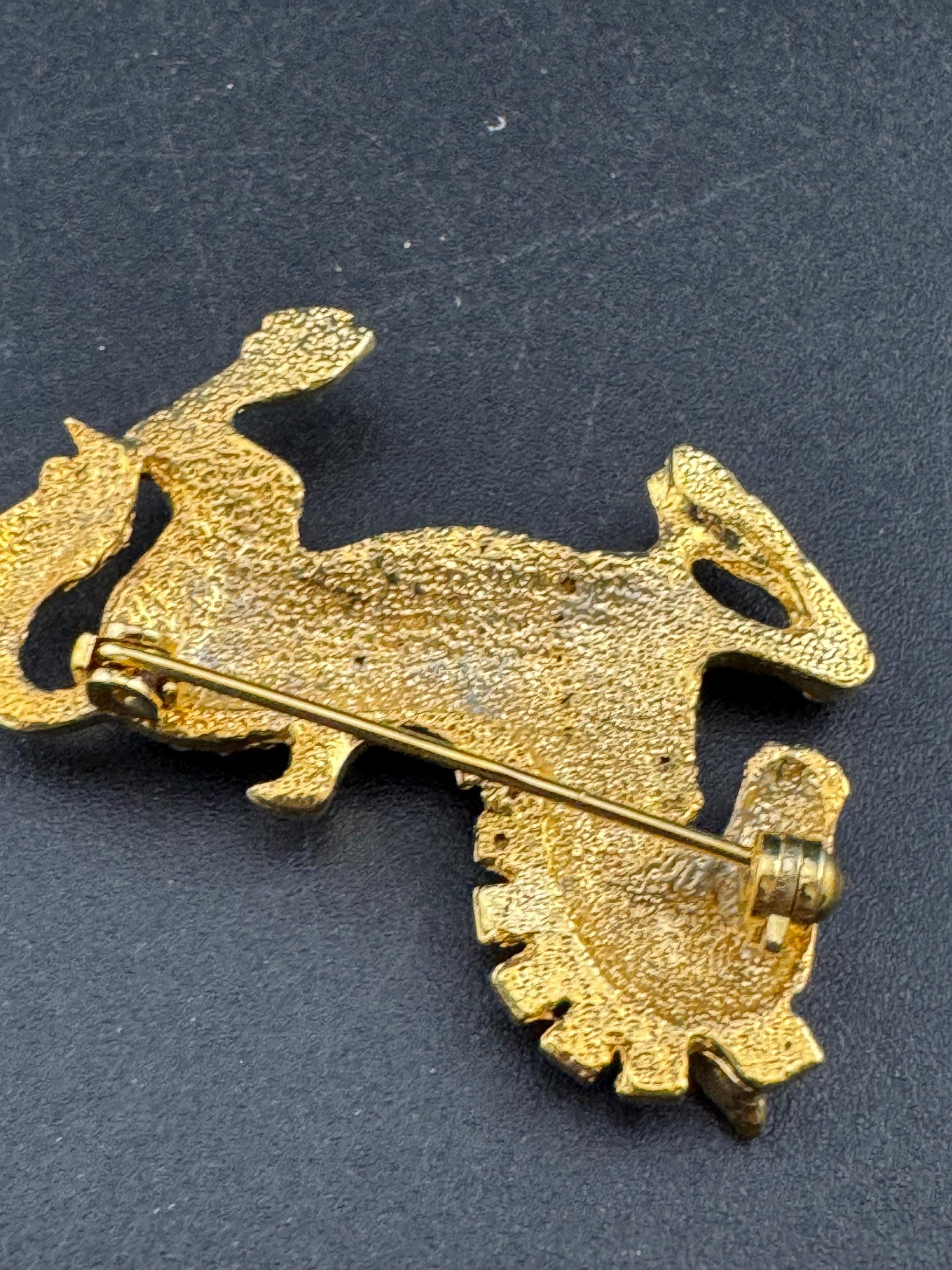 Vintage clear crystal rhinestone horse brooch, gold tone