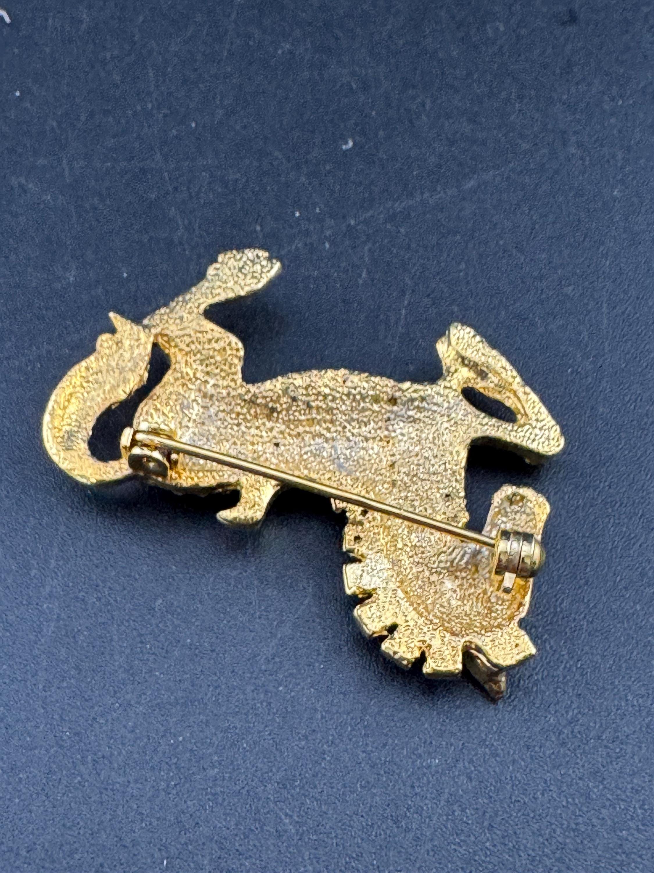 Vintage clear crystal rhinestone horse brooch, gold tone