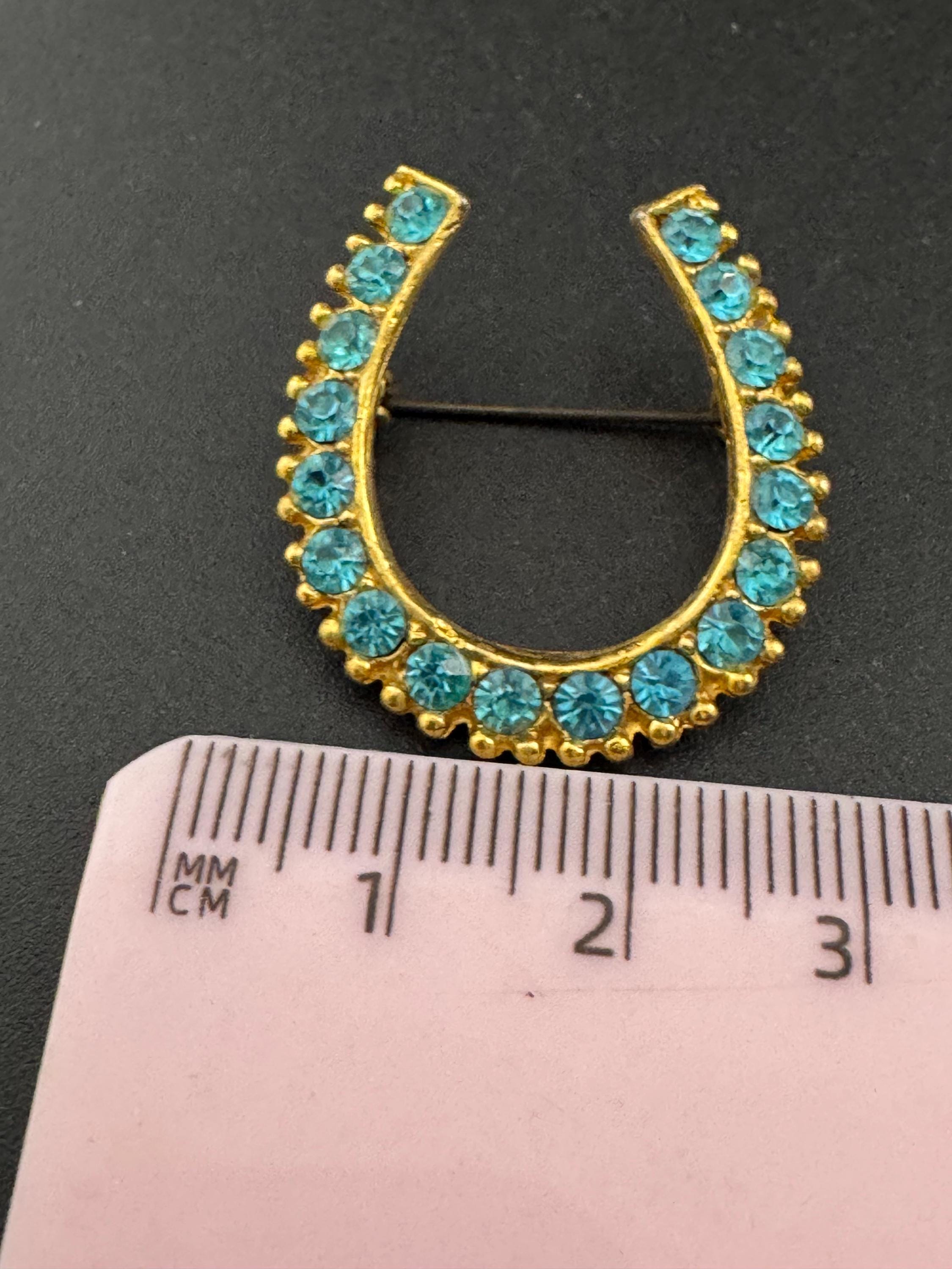 Vintage blue crystal lucky horseshoe rhinestone brooch