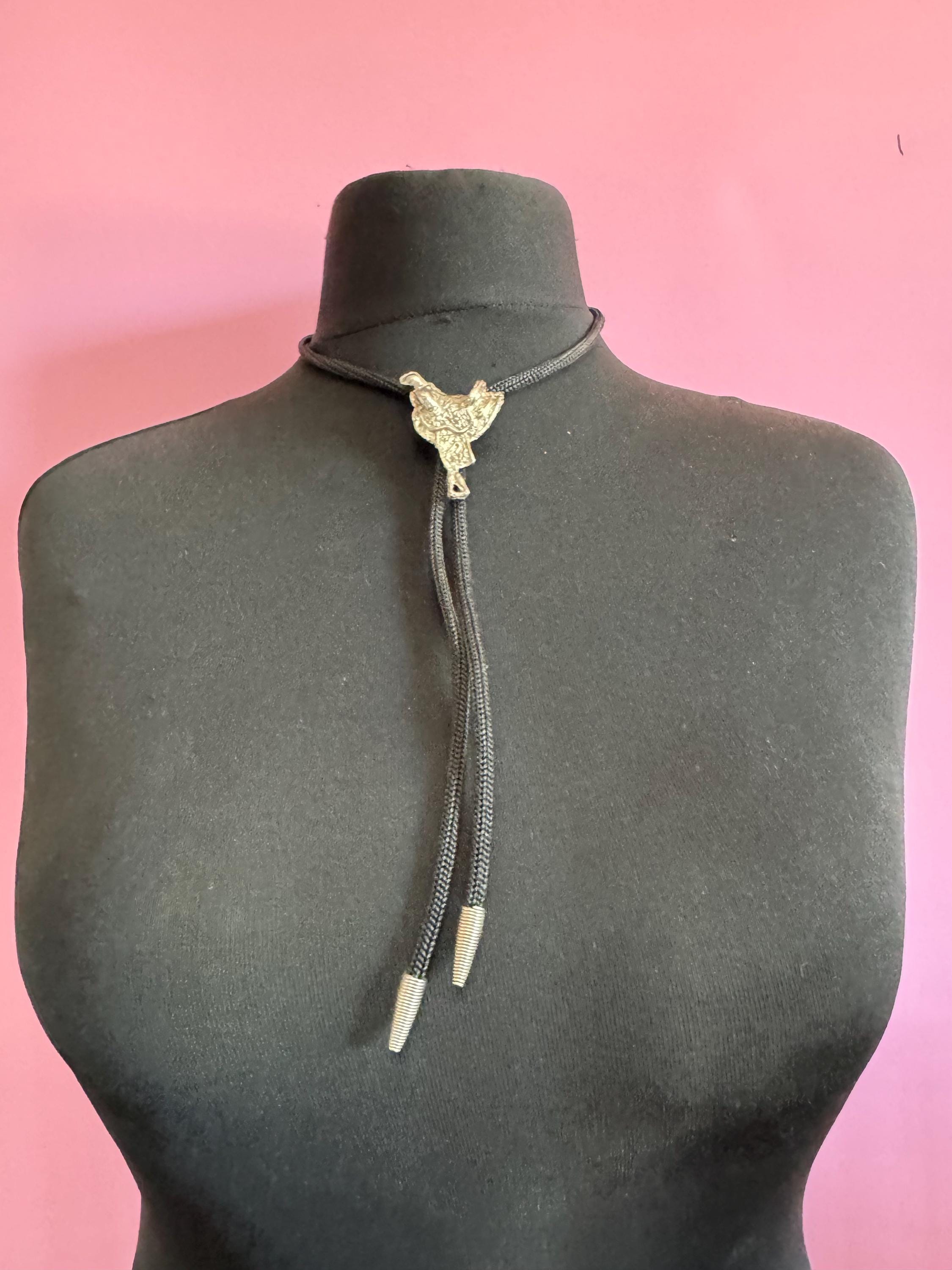 Retro western style horse saddle bolo tie with black woven leather