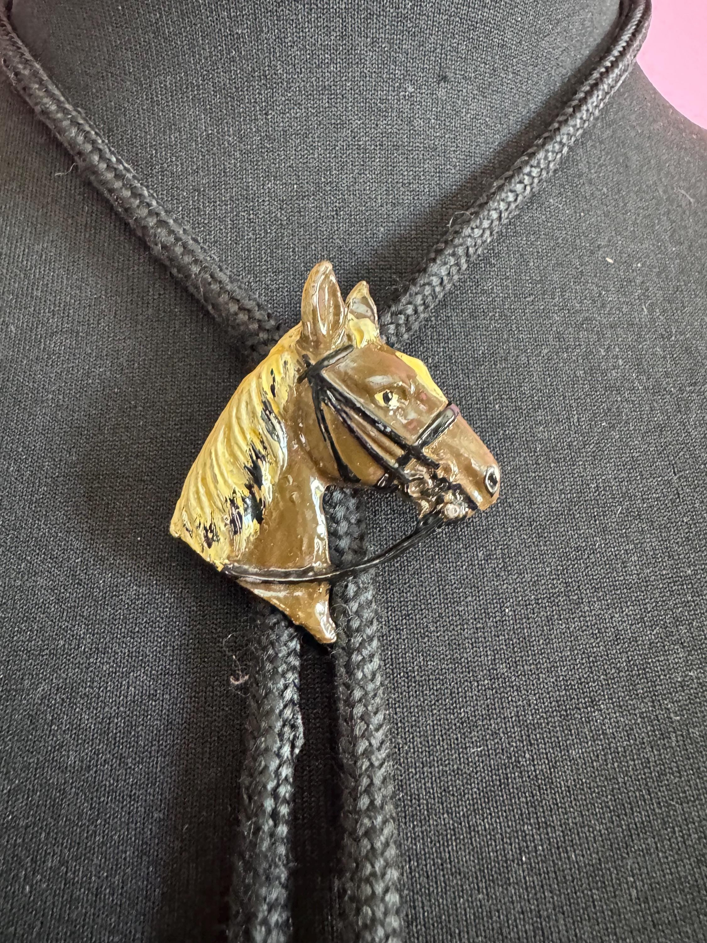Retro western style brown enamel horse bolo tie with black woven cord