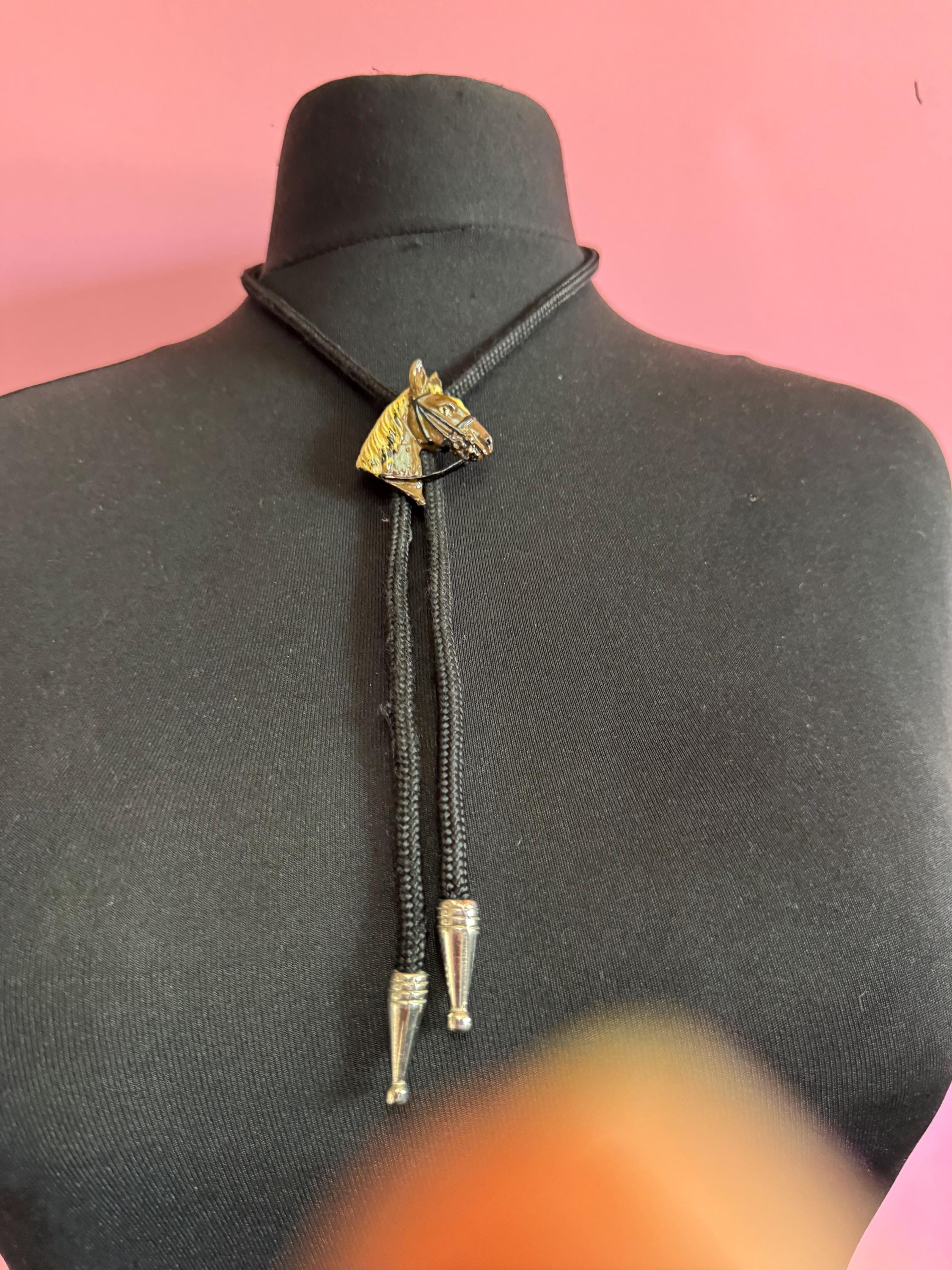 Retro western style brown enamel horse bolo tie with black woven cord