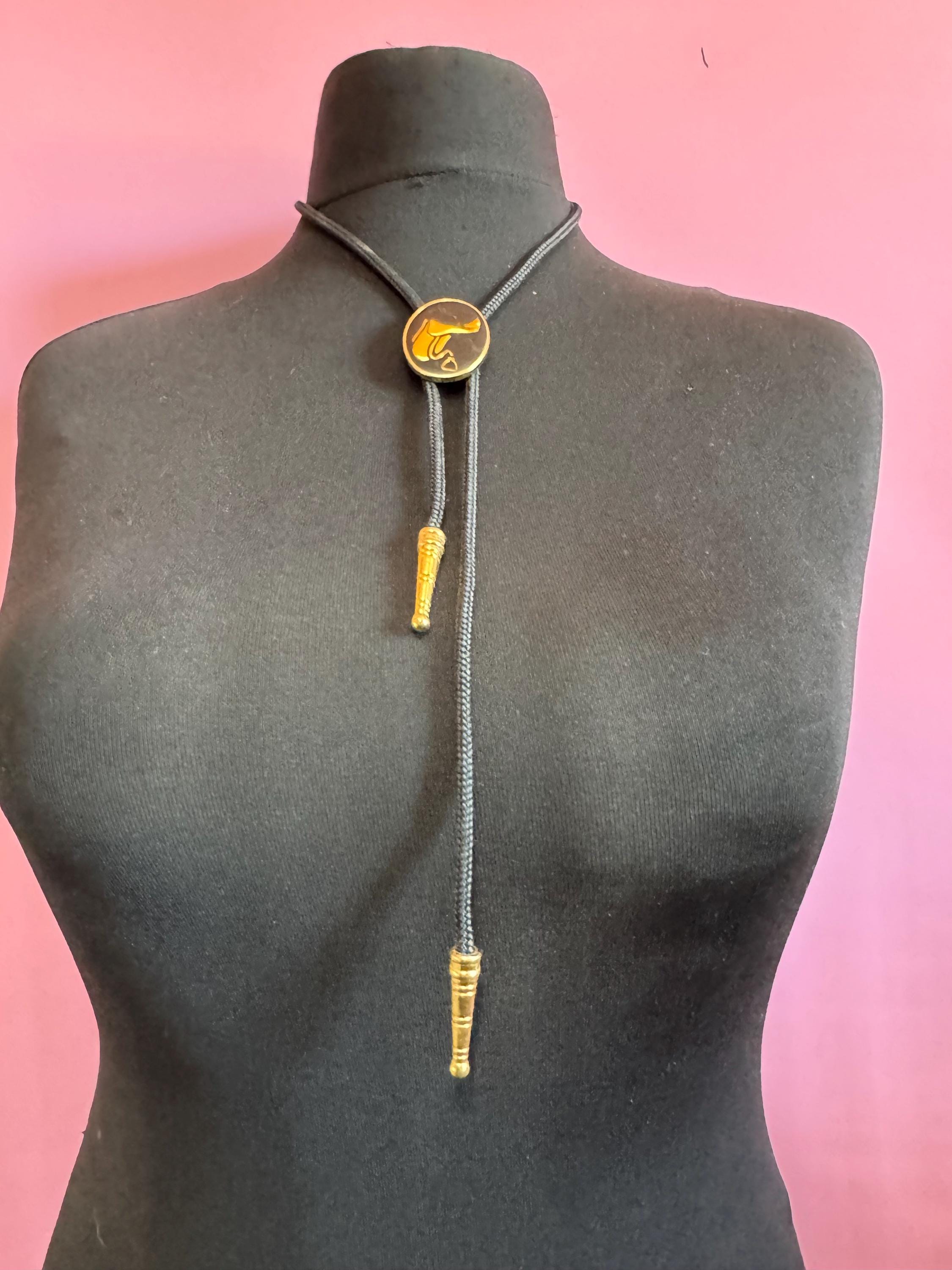 Retro western style gold black enamel horse saddle bolo tie with black woven cord