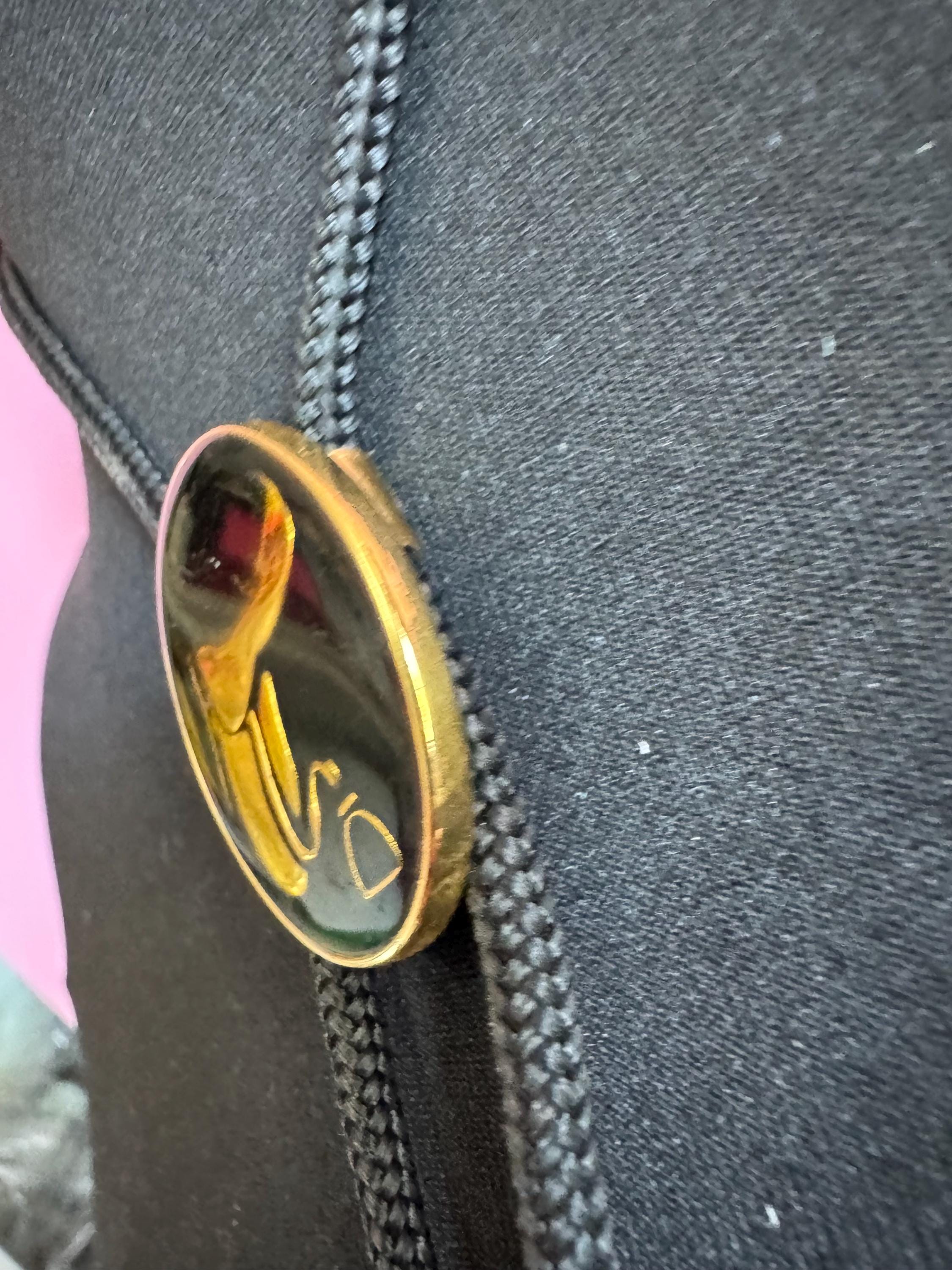 Retro western style gold black enamel horse saddle bolo tie with black woven cord