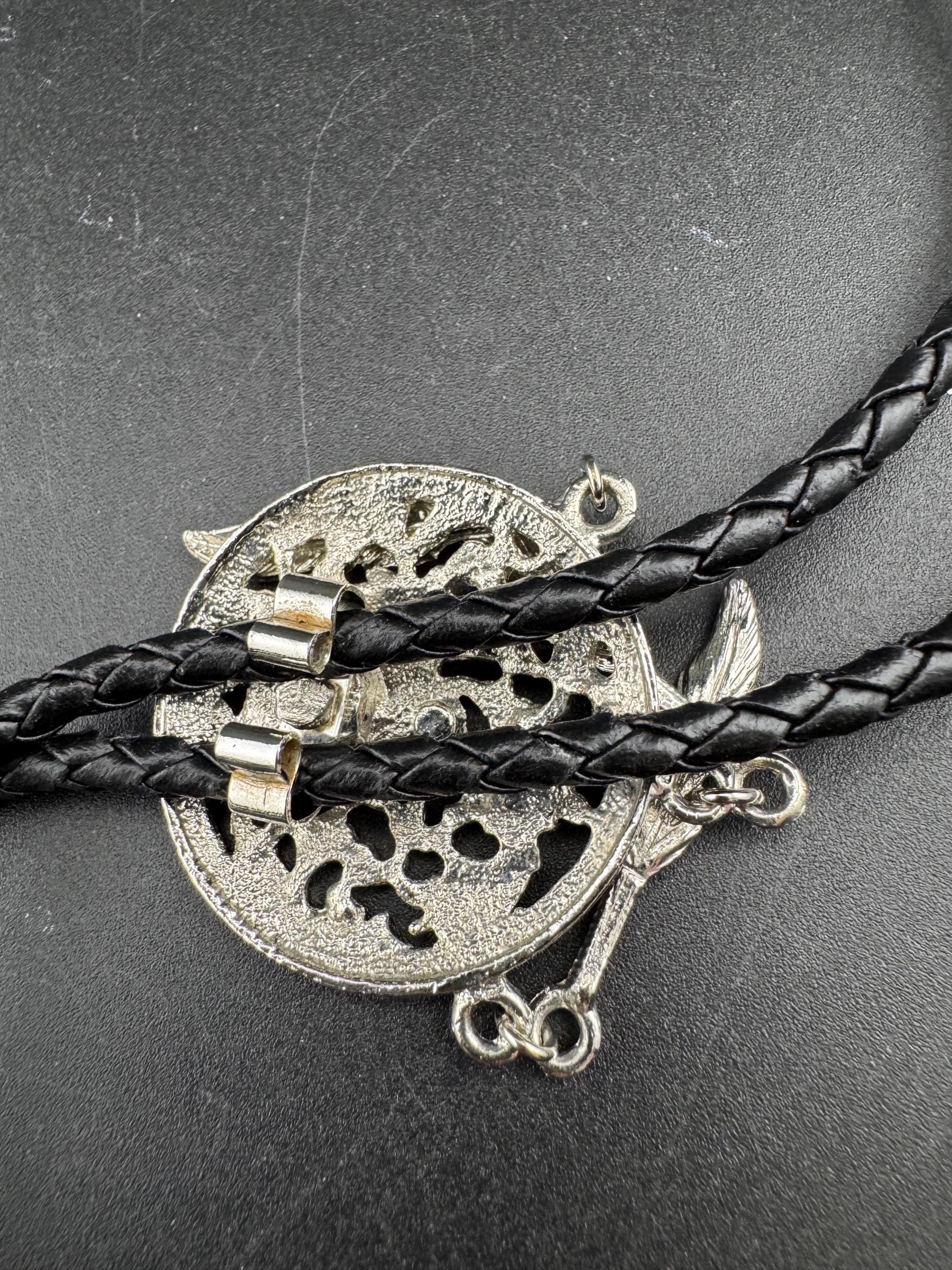 Retro silver tone south western style dream catcher bolo necklace on a leather cord
