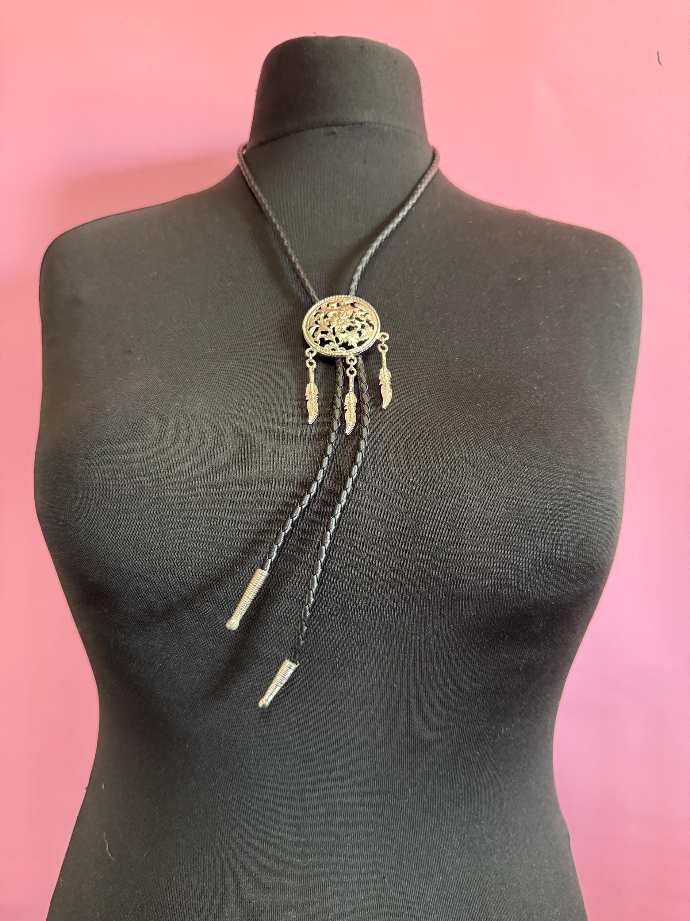 Retro silver tone south western style dream catcher bolo necklace on a leather cord