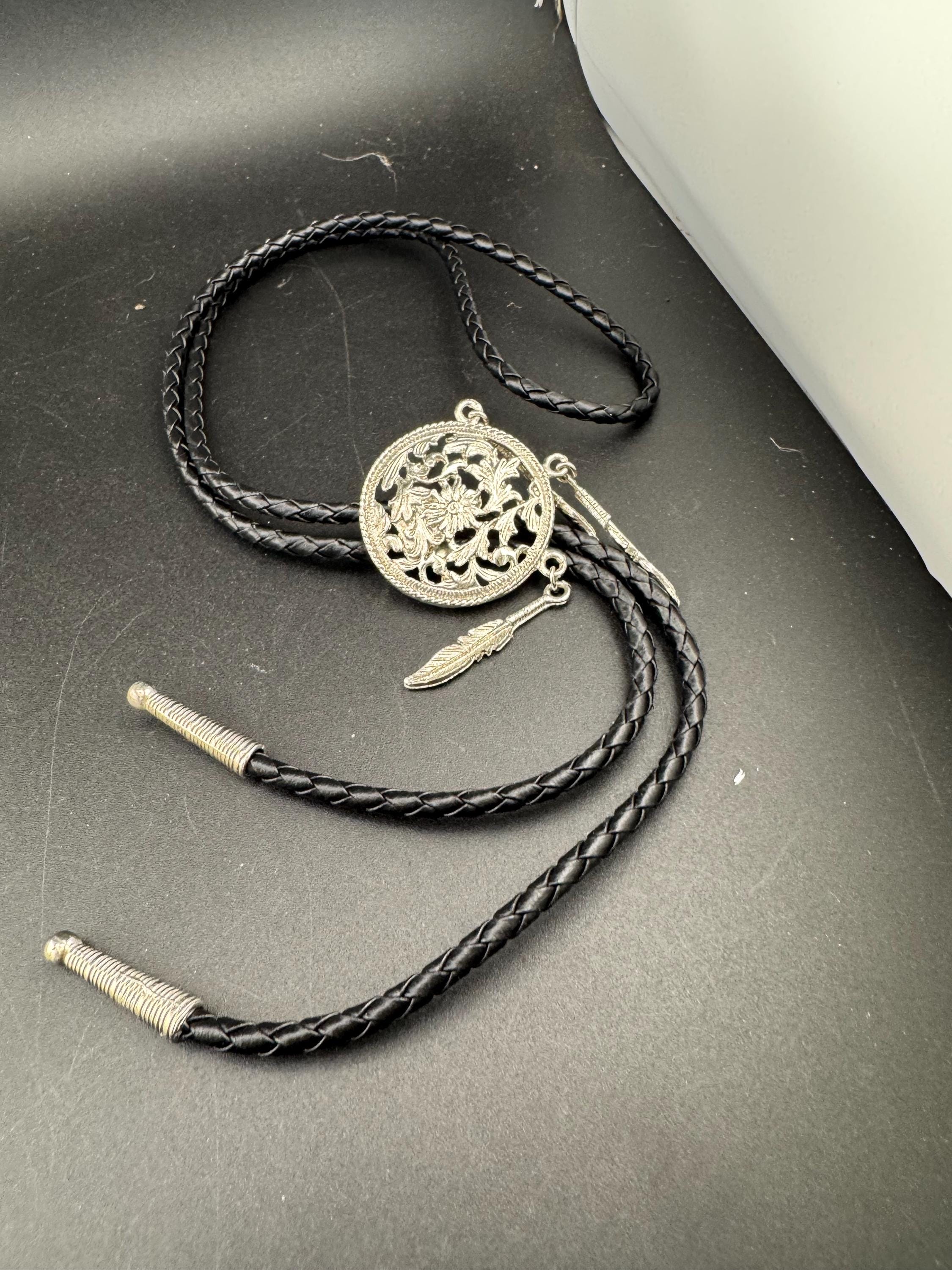 Retro silver tone south western style dream catcher bolo necklace on a leather cord