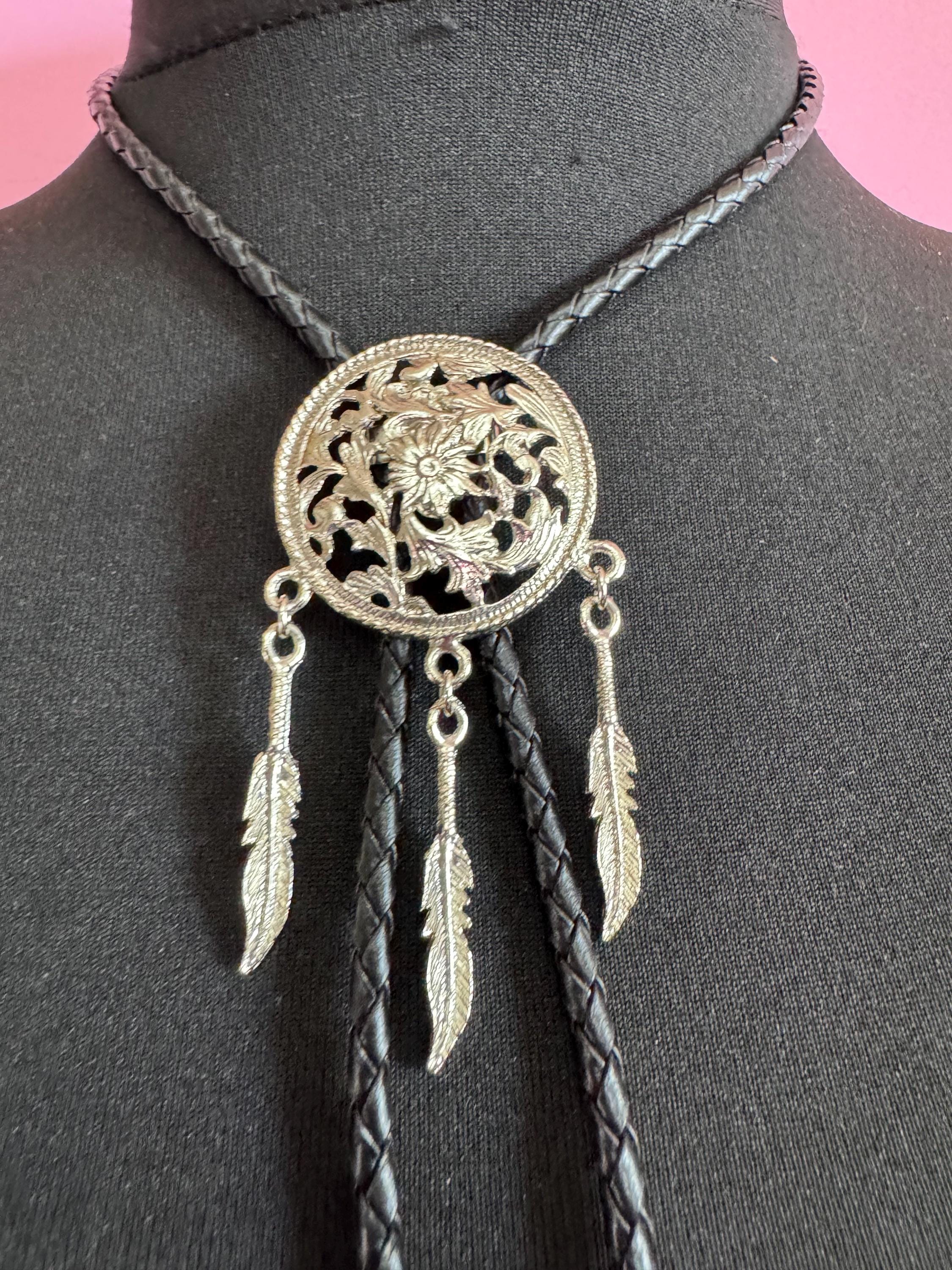 Retro silver tone south western style dream catcher bolo necklace on a leather cord