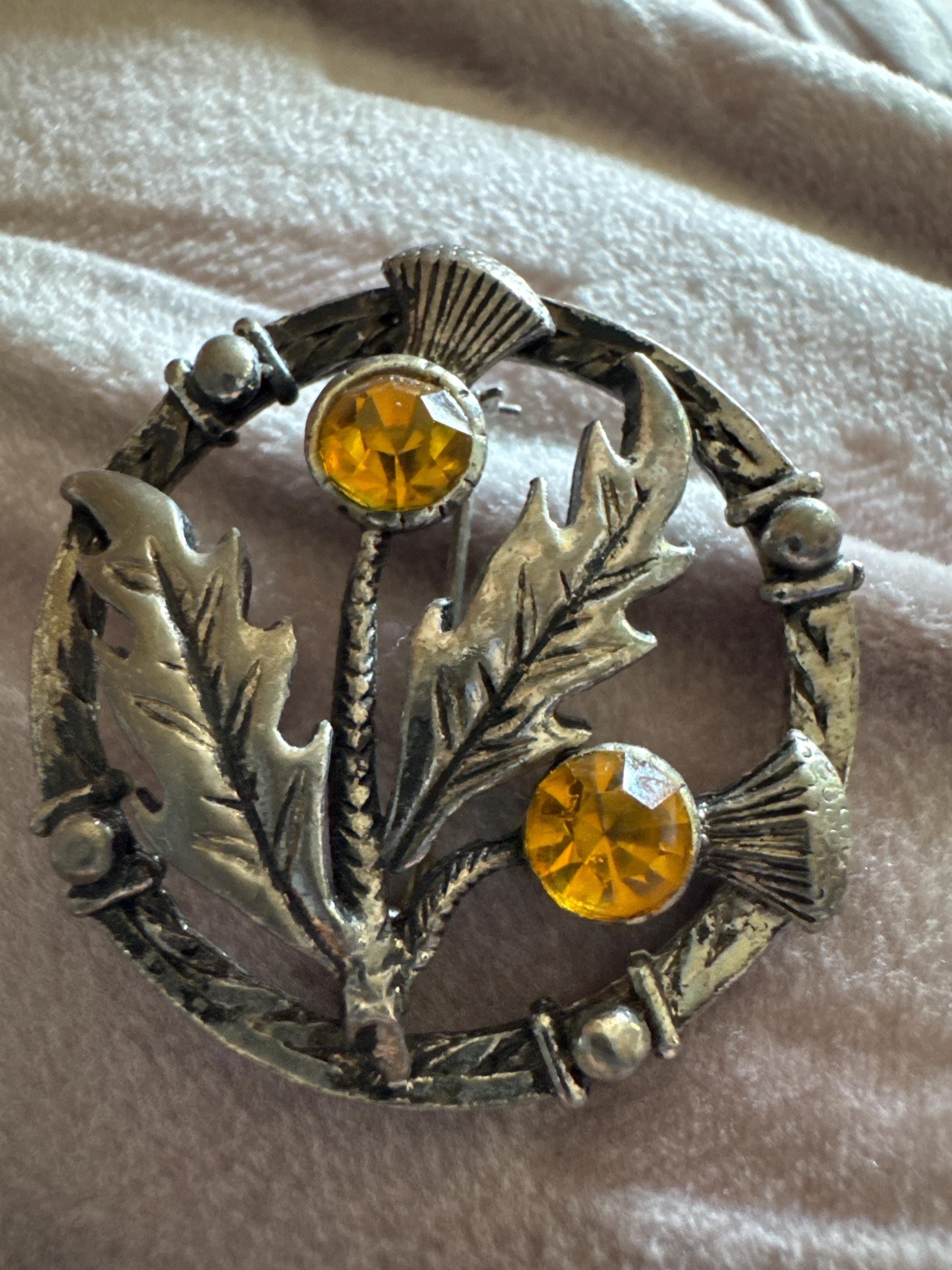 Vintage Scottish thistle brooch set with faux glass citrine, silver tone