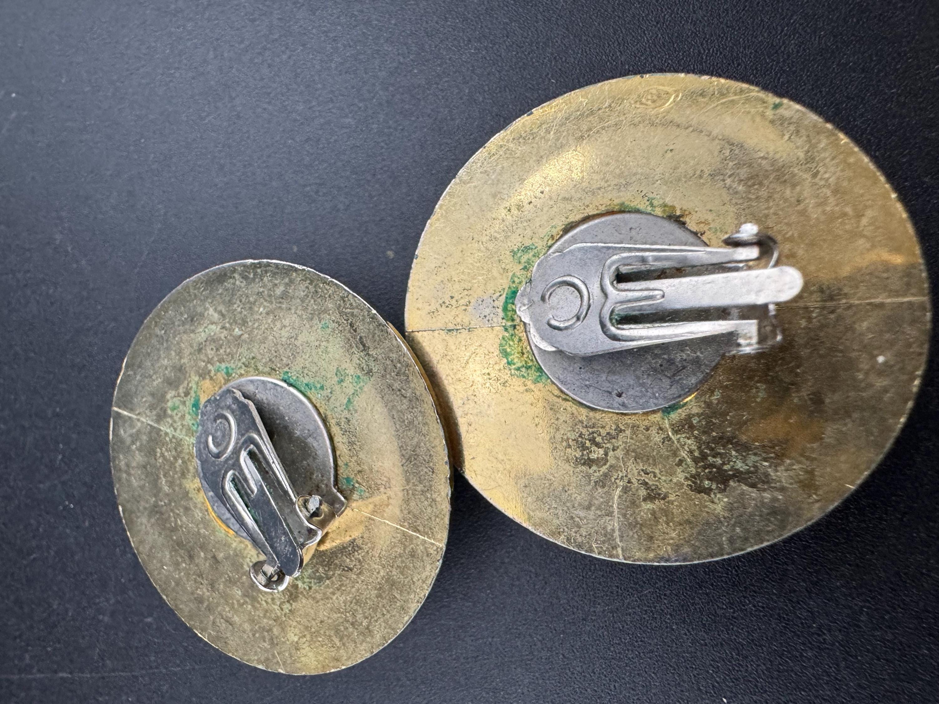 oversized round gold tone plastic disc button domed clip on earrings