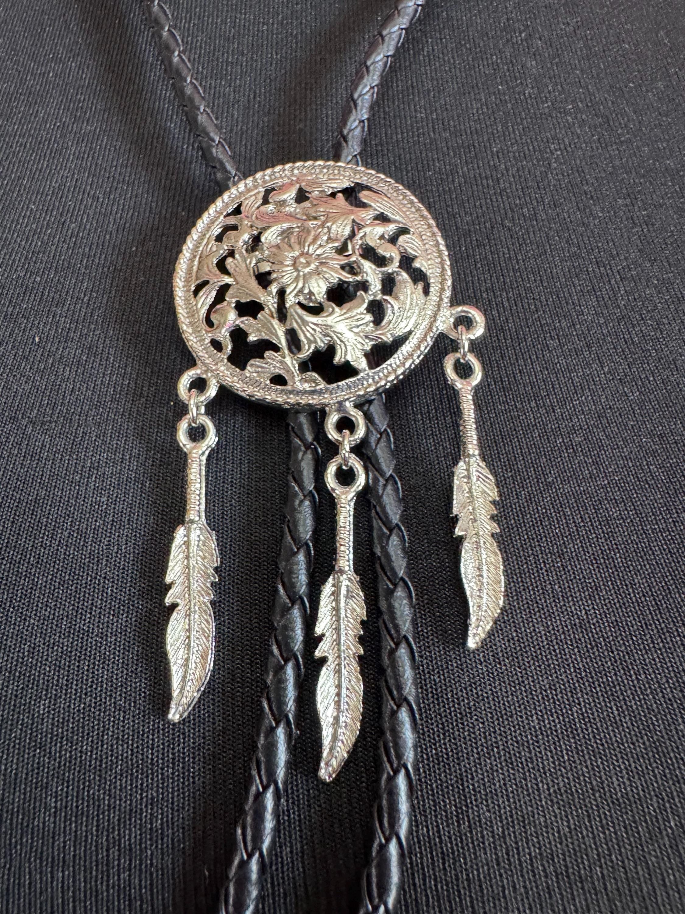 Retro silver tone south western style dream catcher bolo necklace on a leather cord
