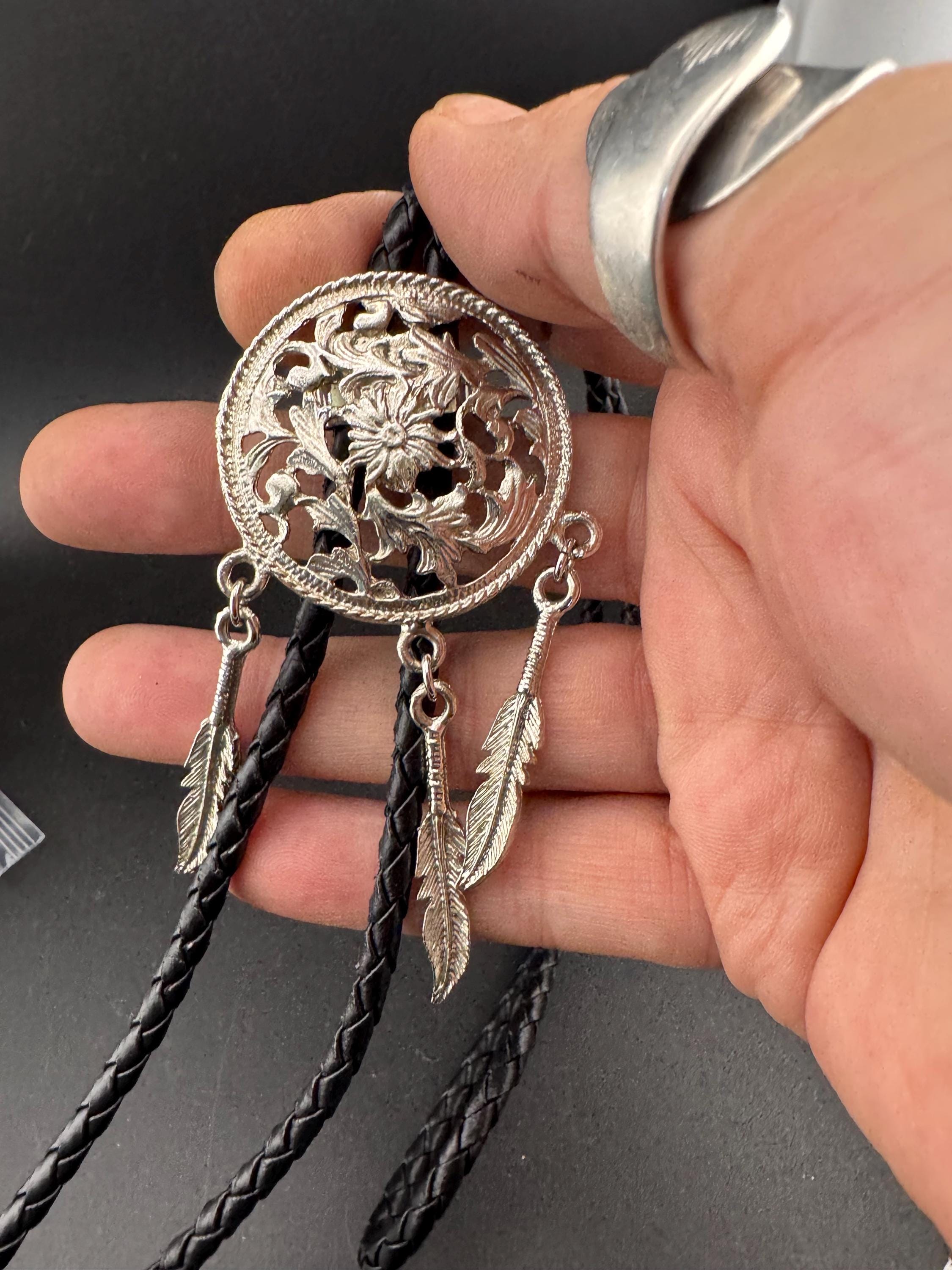 Retro silver tone south western style dream catcher bolo necklace on a leather cord