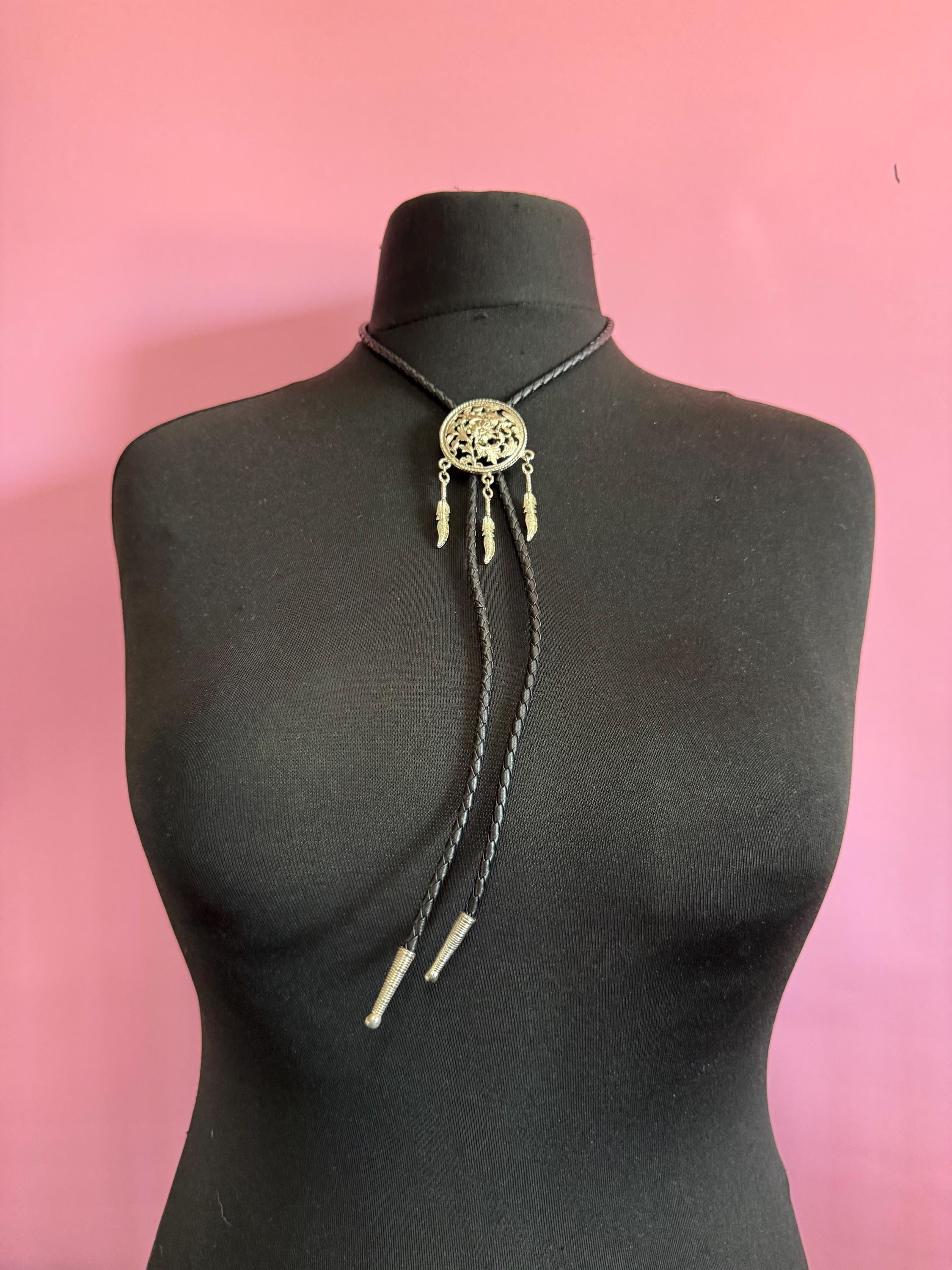Retro silver tone south western style dream catcher bolo necklace on a leather cord