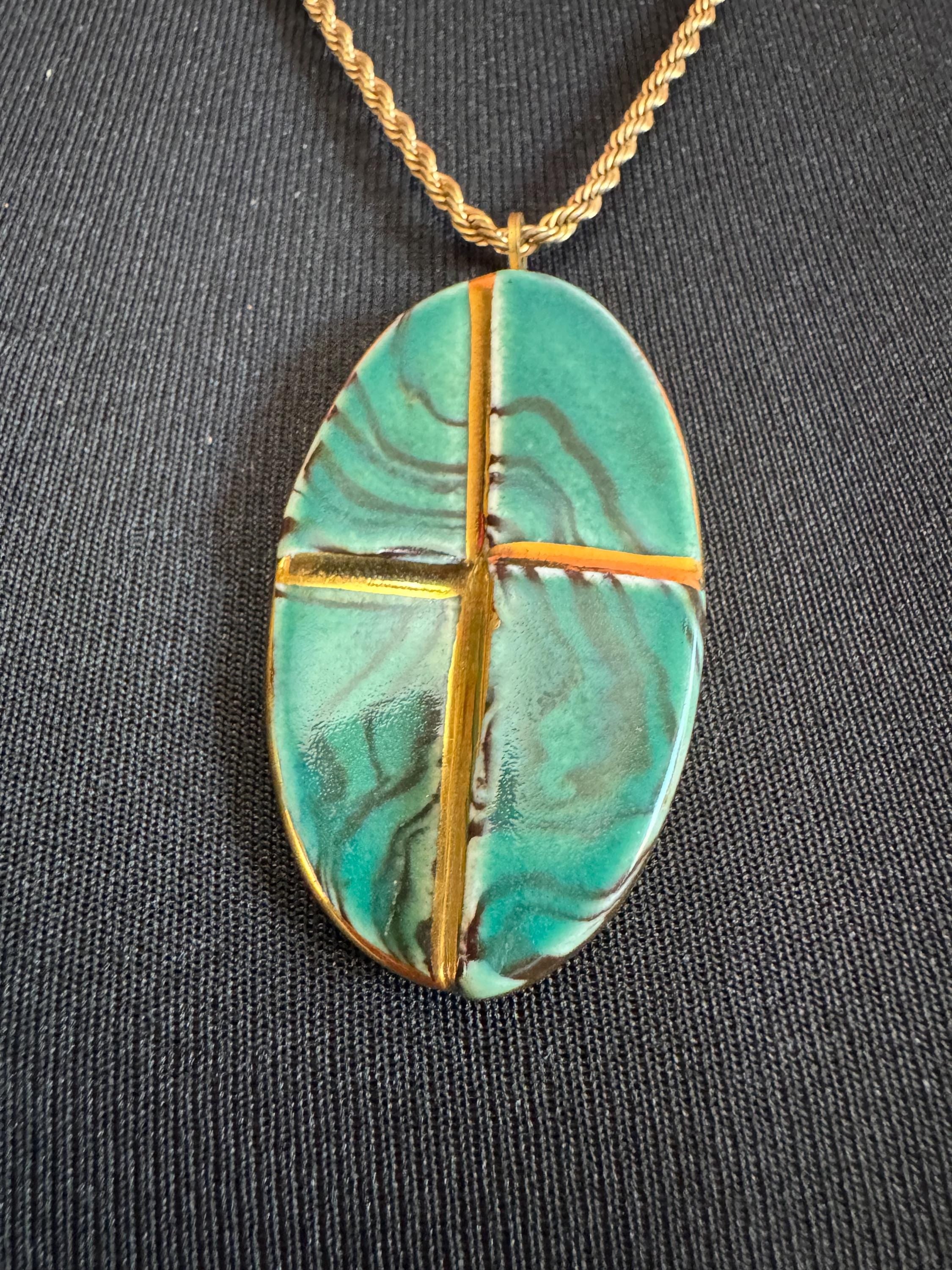 Vintage 1970s green and gold enamel pottery pendant necklace