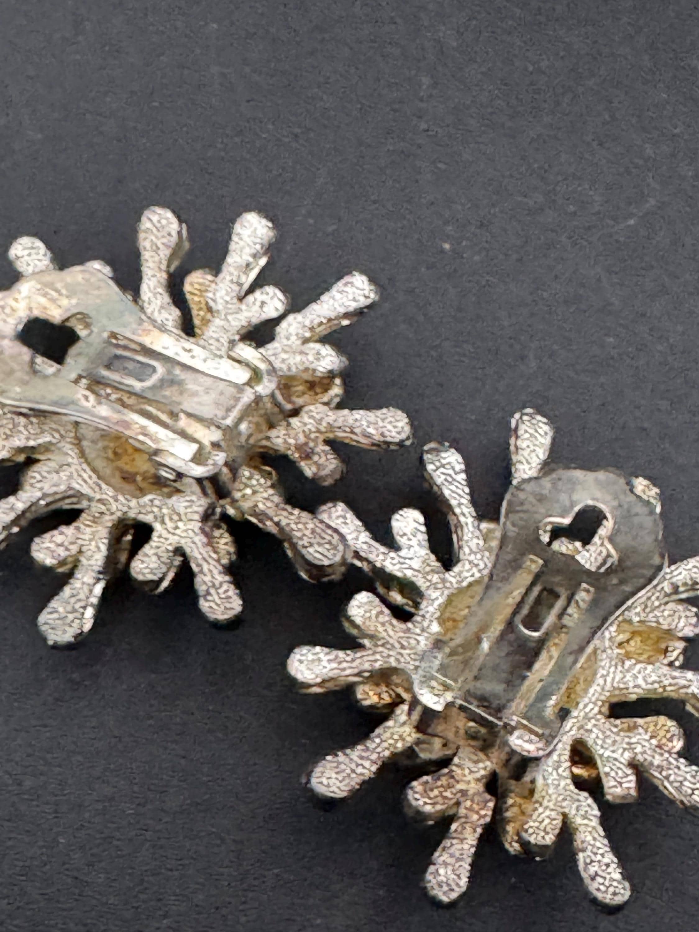 1970s brutalist spikey star clip on earrings, silver tone