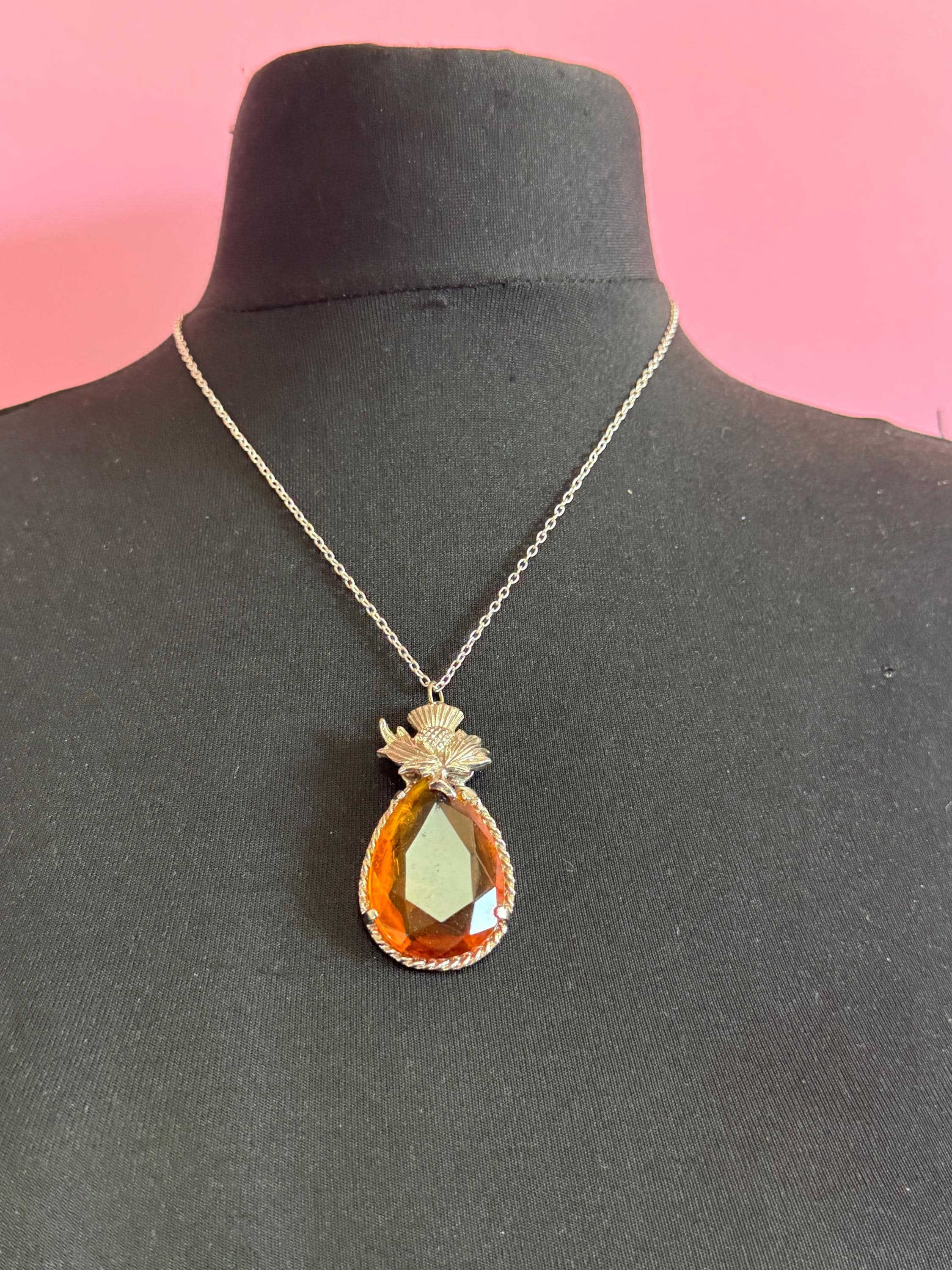 Scottish thistle orange faceted Glass teardrop pendant on 50cm later chain , silver tone