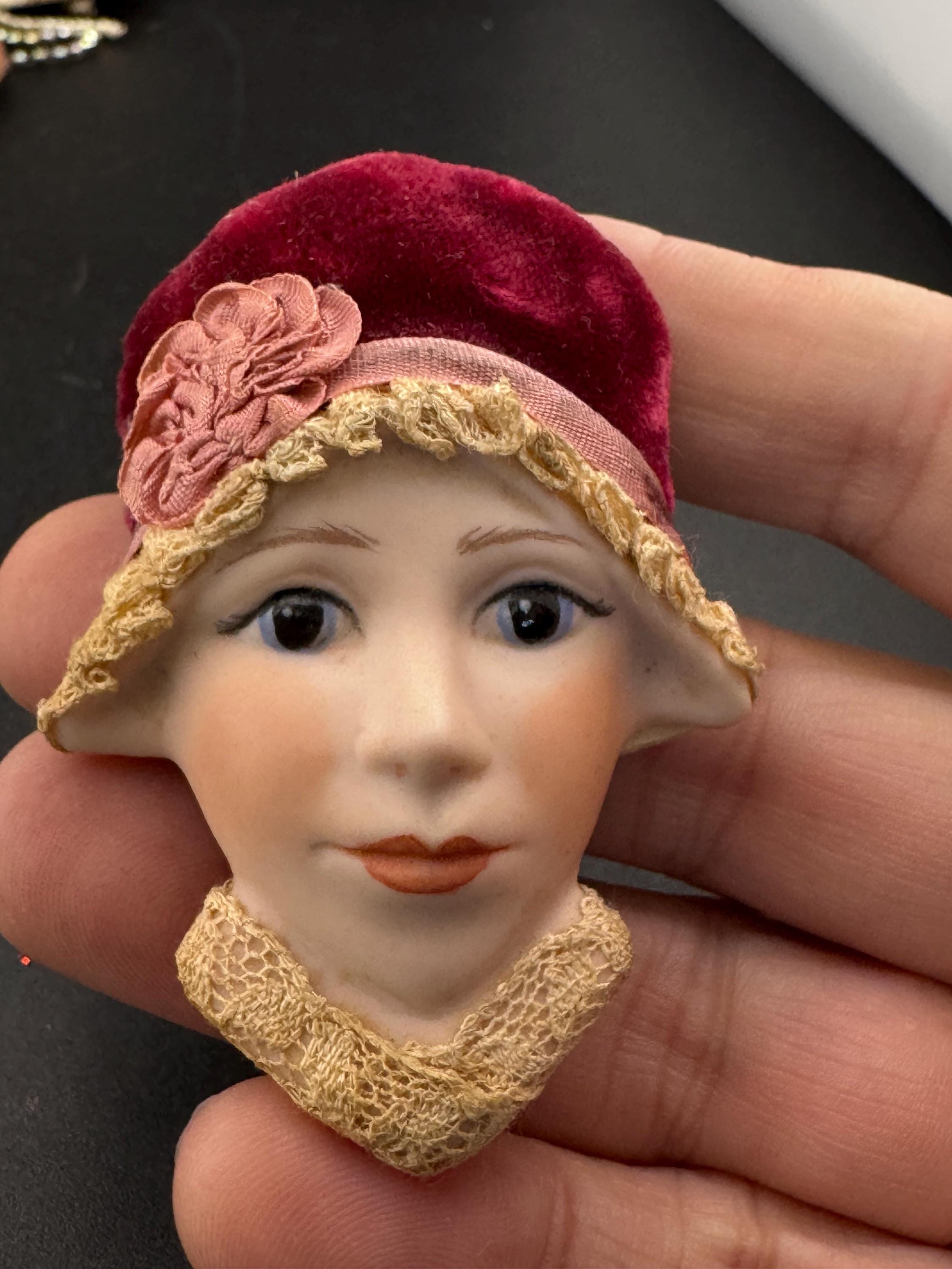 Vintage ceramic flapper face brooch: art deco with red velvet hat
