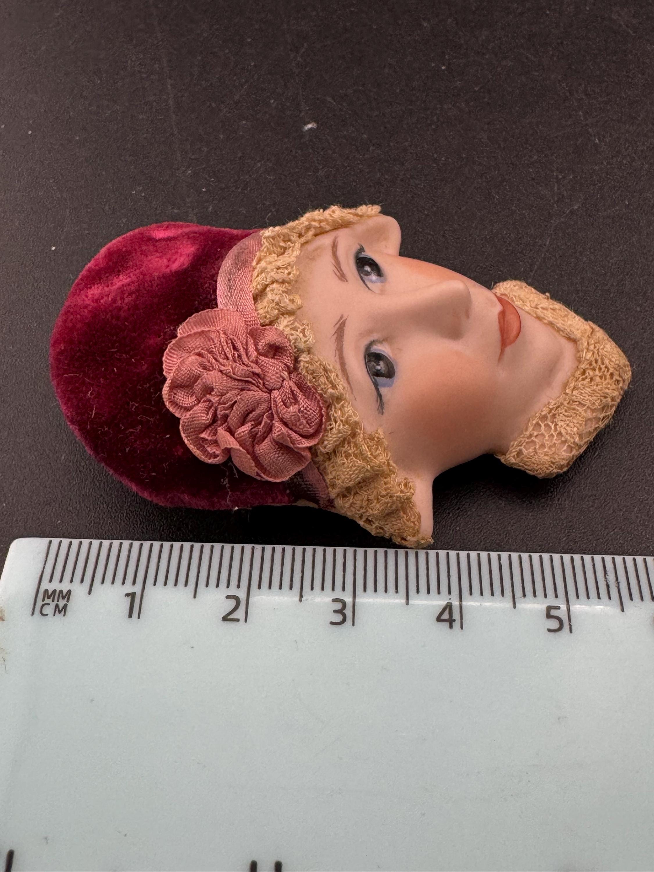 Vintage ceramic flapper face brooch: art deco with red velvet hat