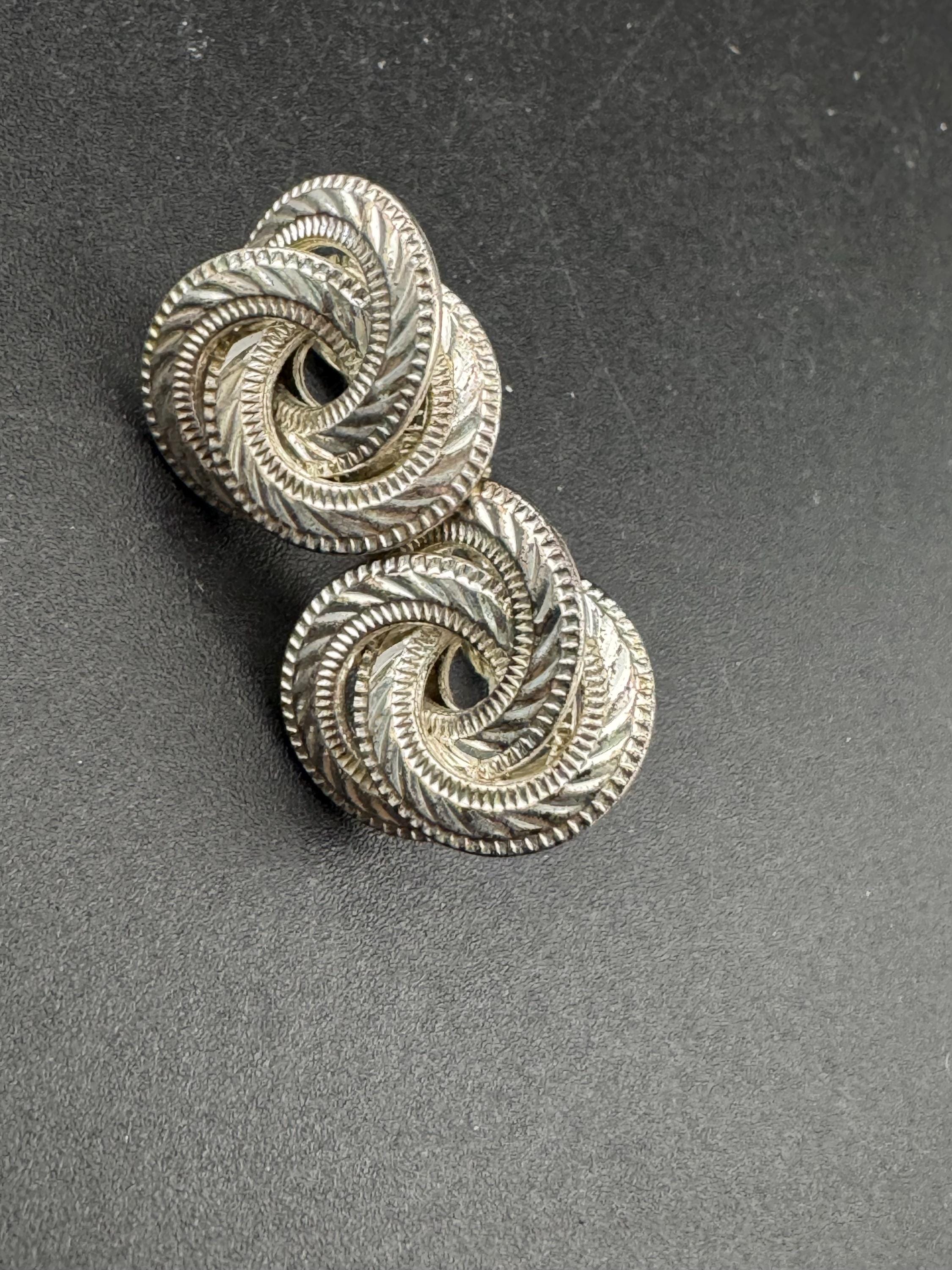 Signed NAPIER swirl knot clip on earrings, silver tone designer