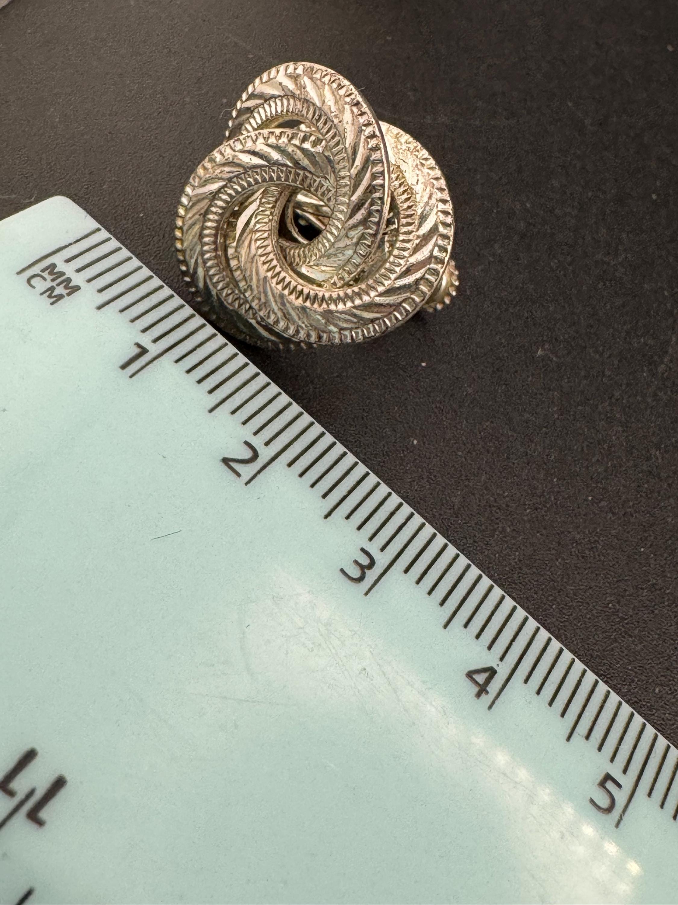 Signed NAPIER swirl knot clip on earrings, silver tone designer
