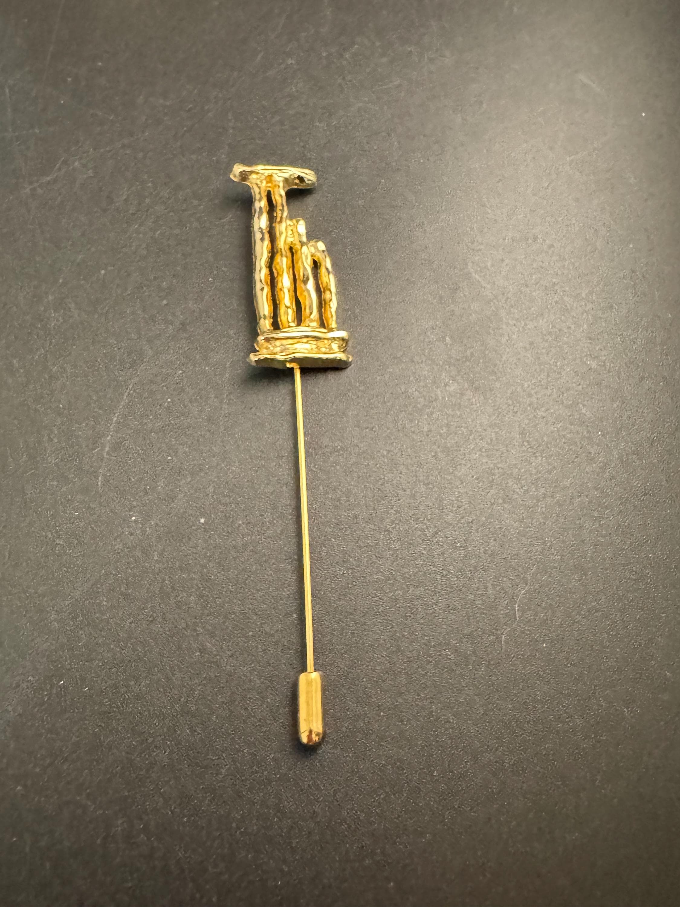 Vintage Un Jour Ailleurs Hat Pin: Gold plated Pillar Brooch  from Paris