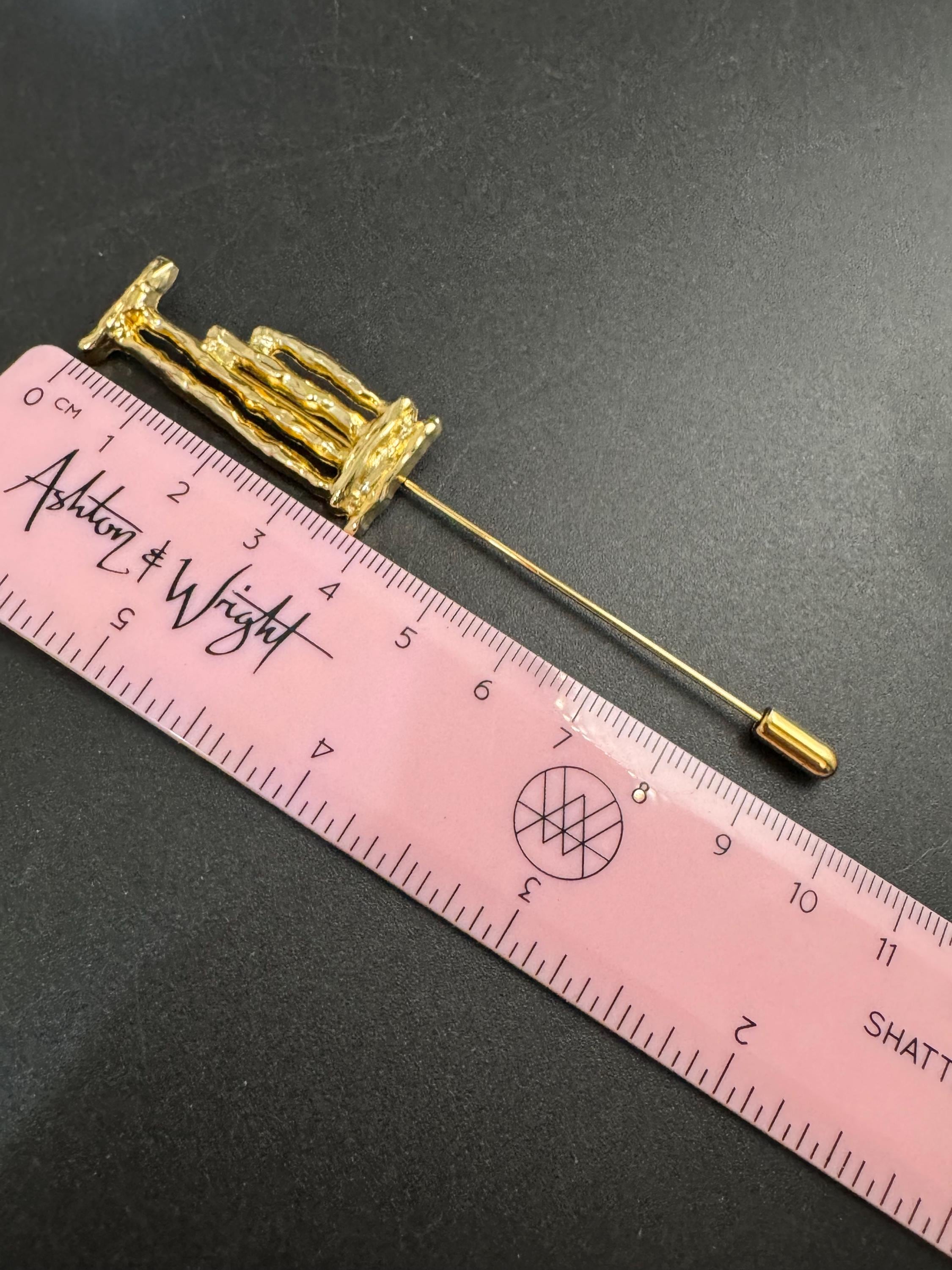 Vintage Un Jour Ailleurs Hat Pin: Gold plated Pillar Brooch  from Paris