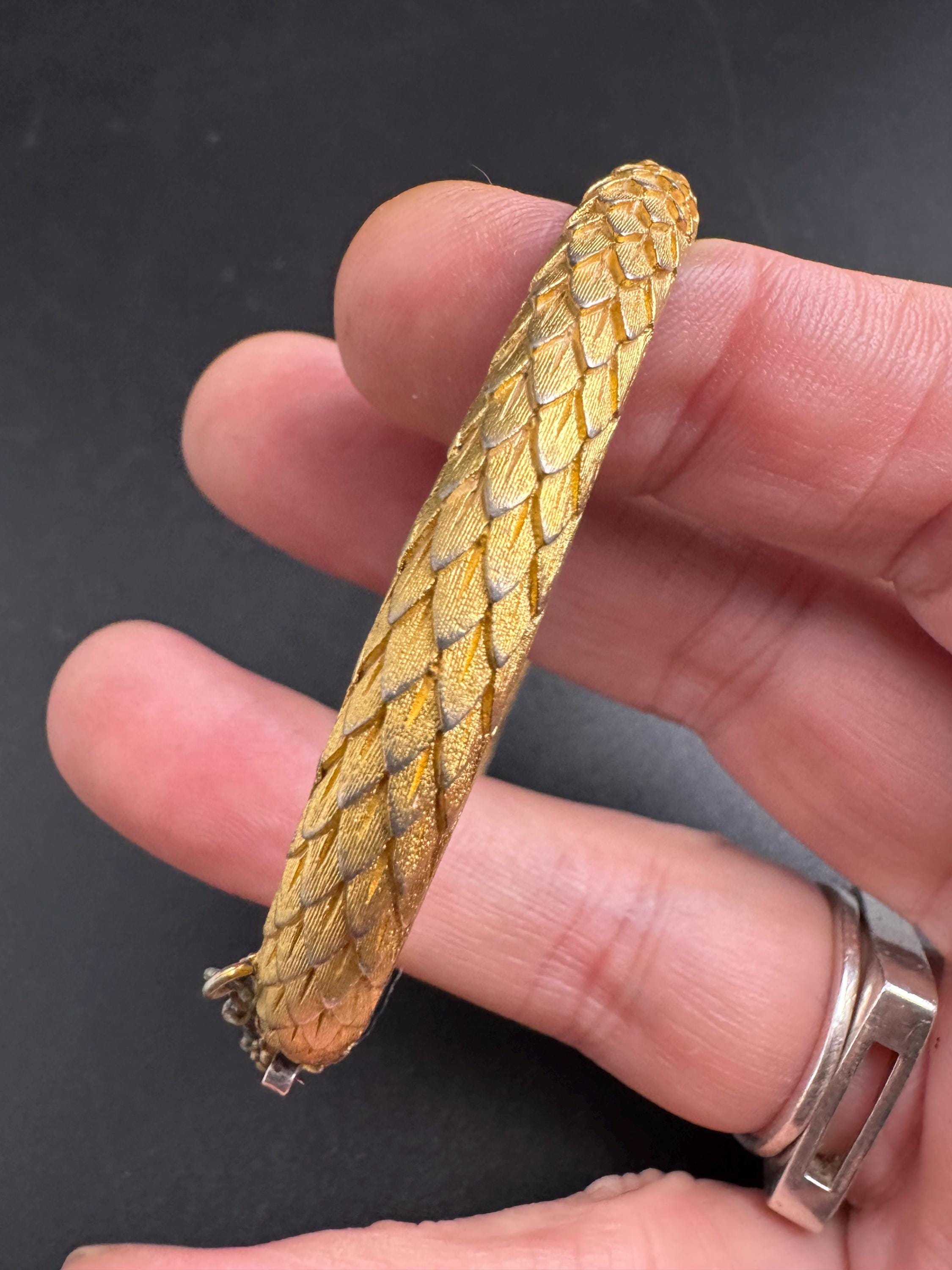 Crown Trifari gold-tone hinged bangle bracelet, textured snake or fish scale pattern