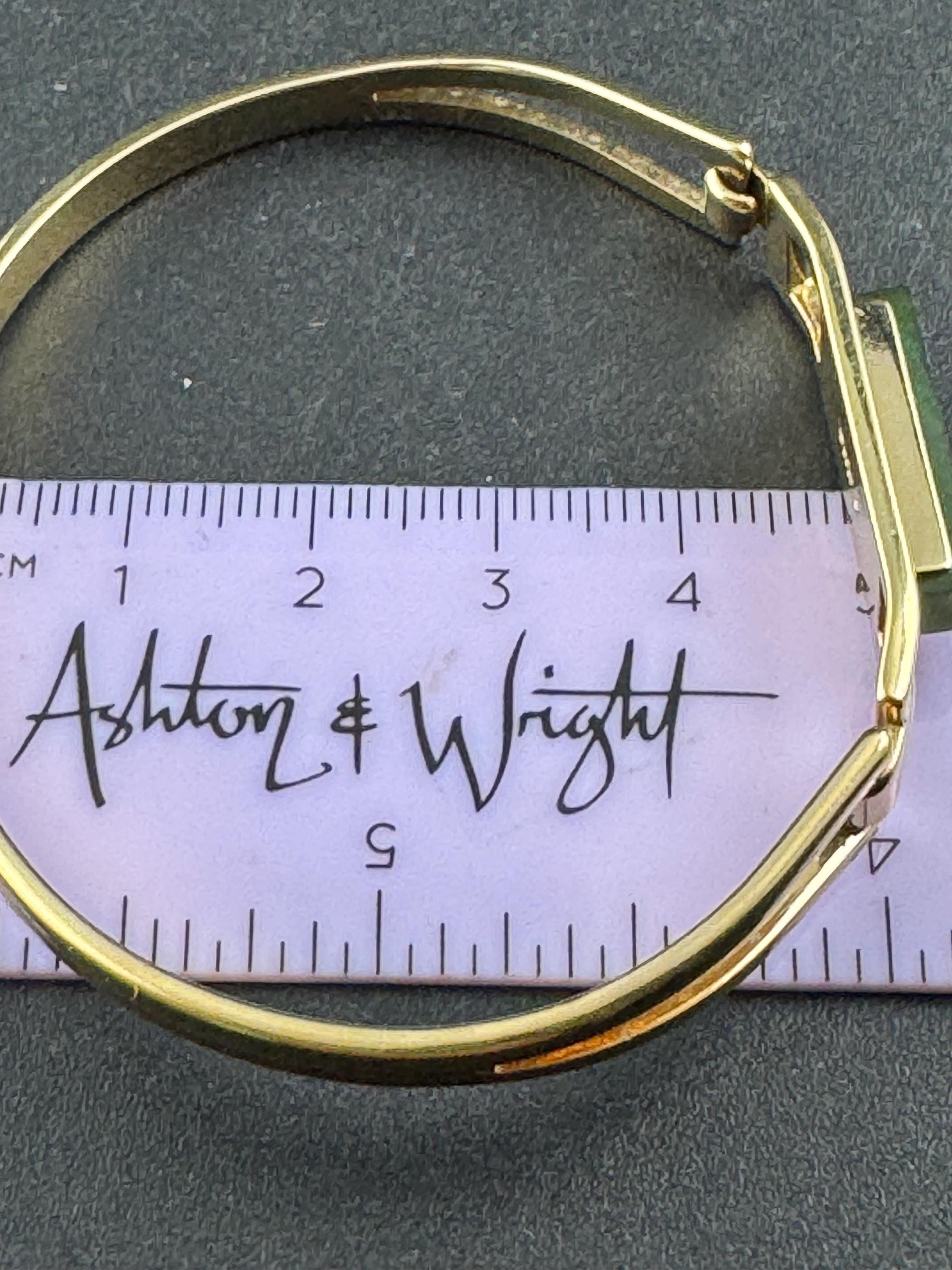 Vintage signed Avon gold tone green jade glass hinged bangle