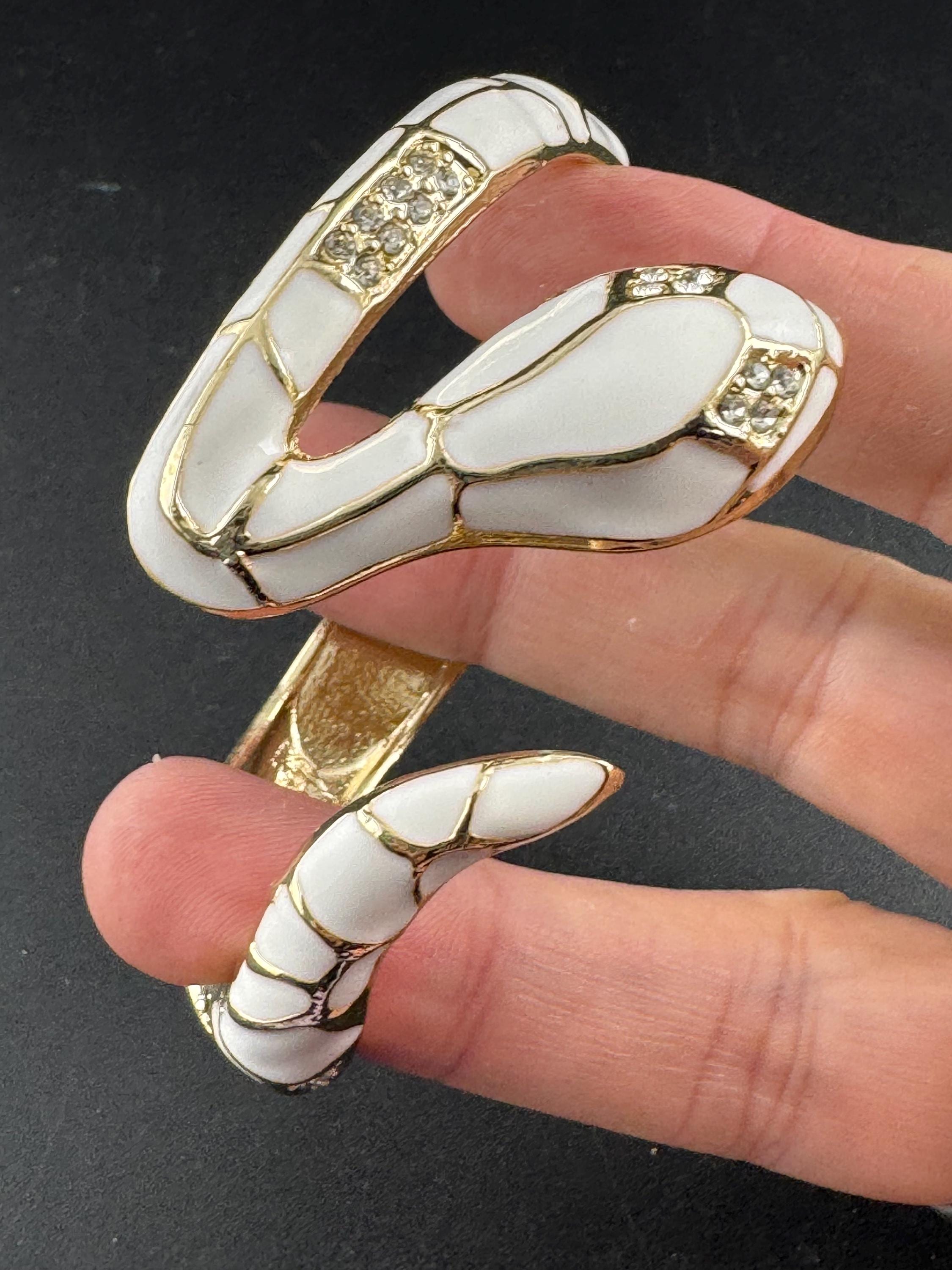 White enamel diamanté hinged snake bangle, clear rhinestone eyes gold tone