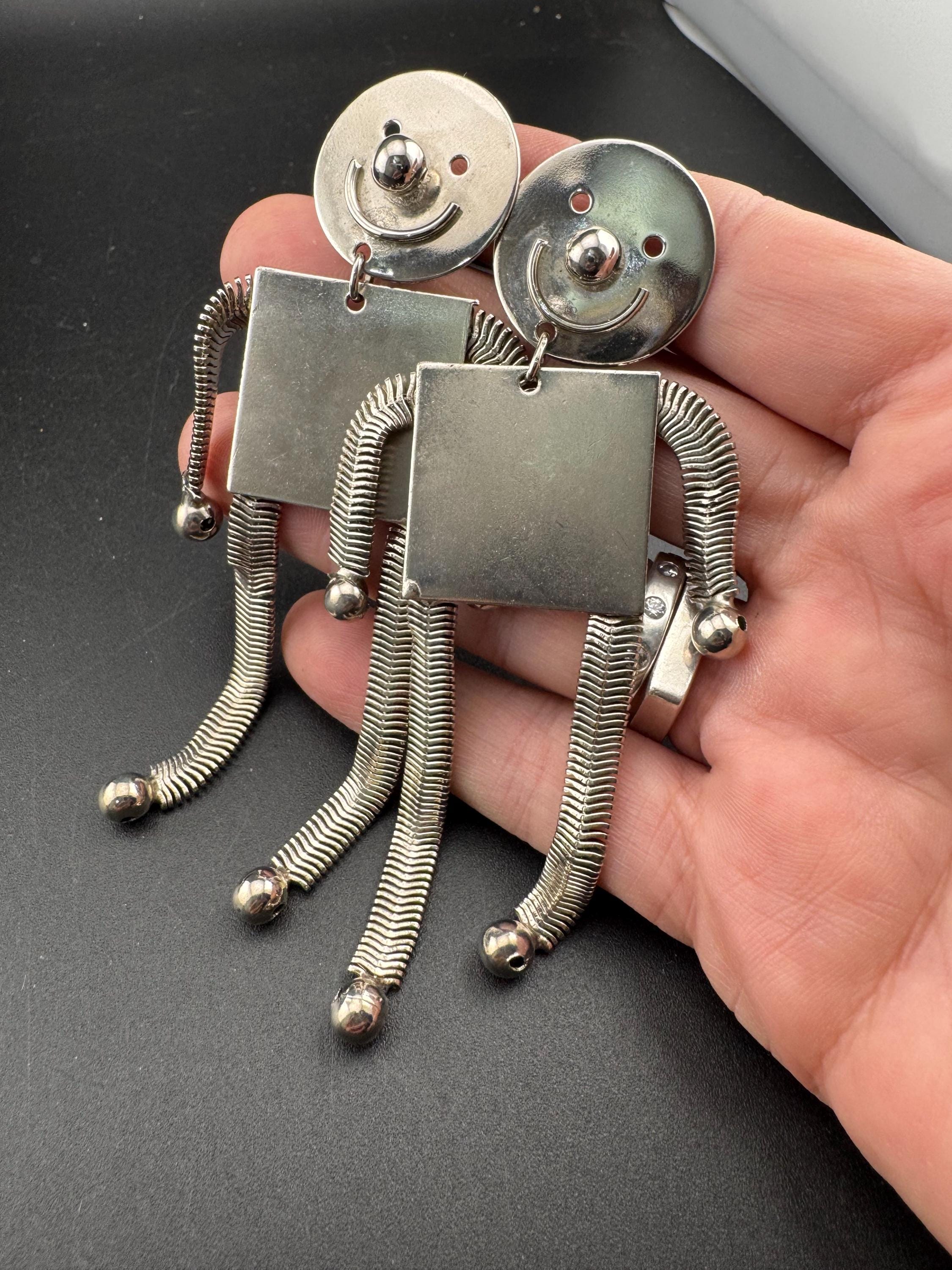 vintage novelty long robot clip on earrings , silver tone articulated