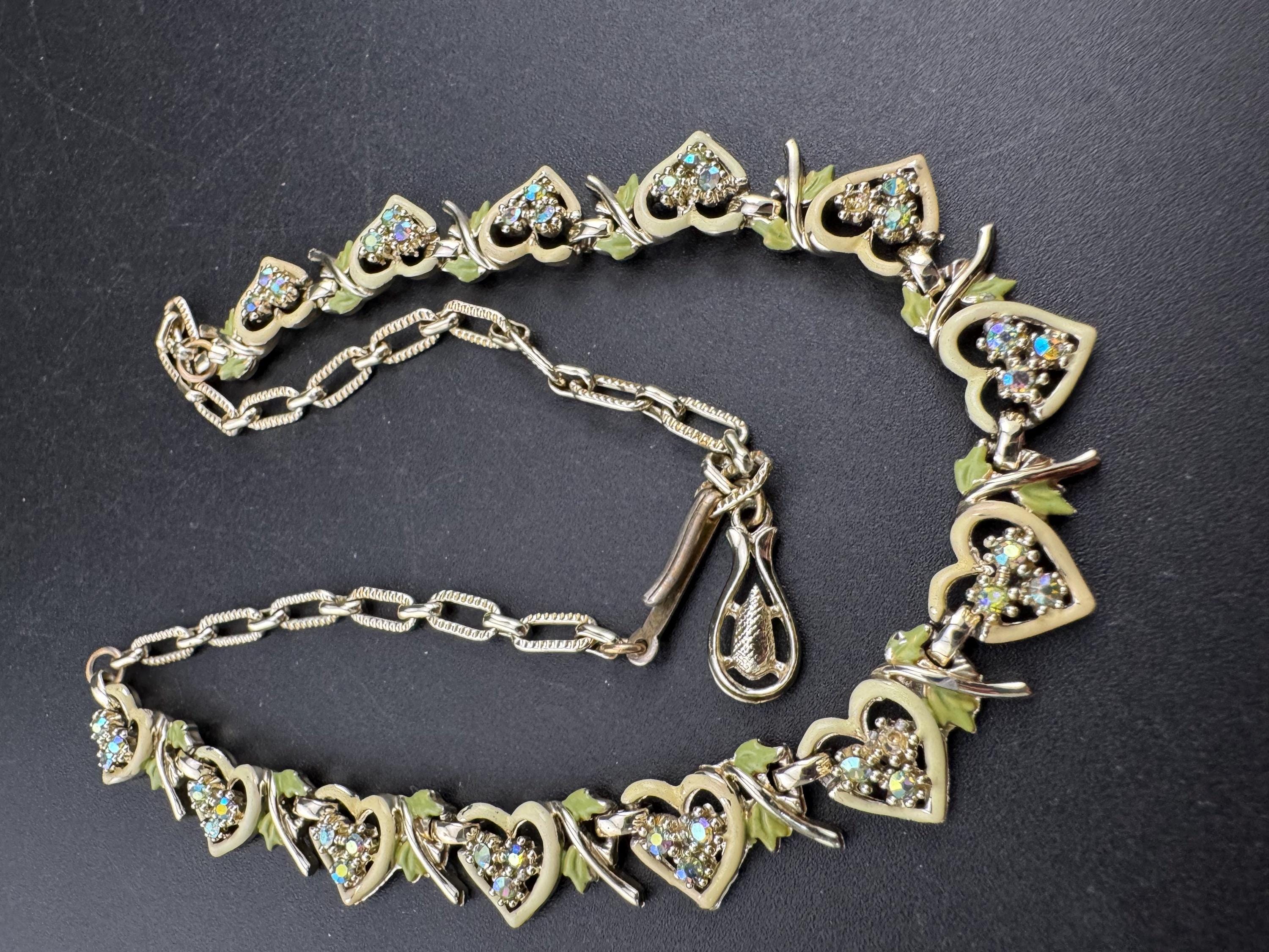 Vintage Aurora borealis and cream enamel heart necklace, light gold tone with rhinestone