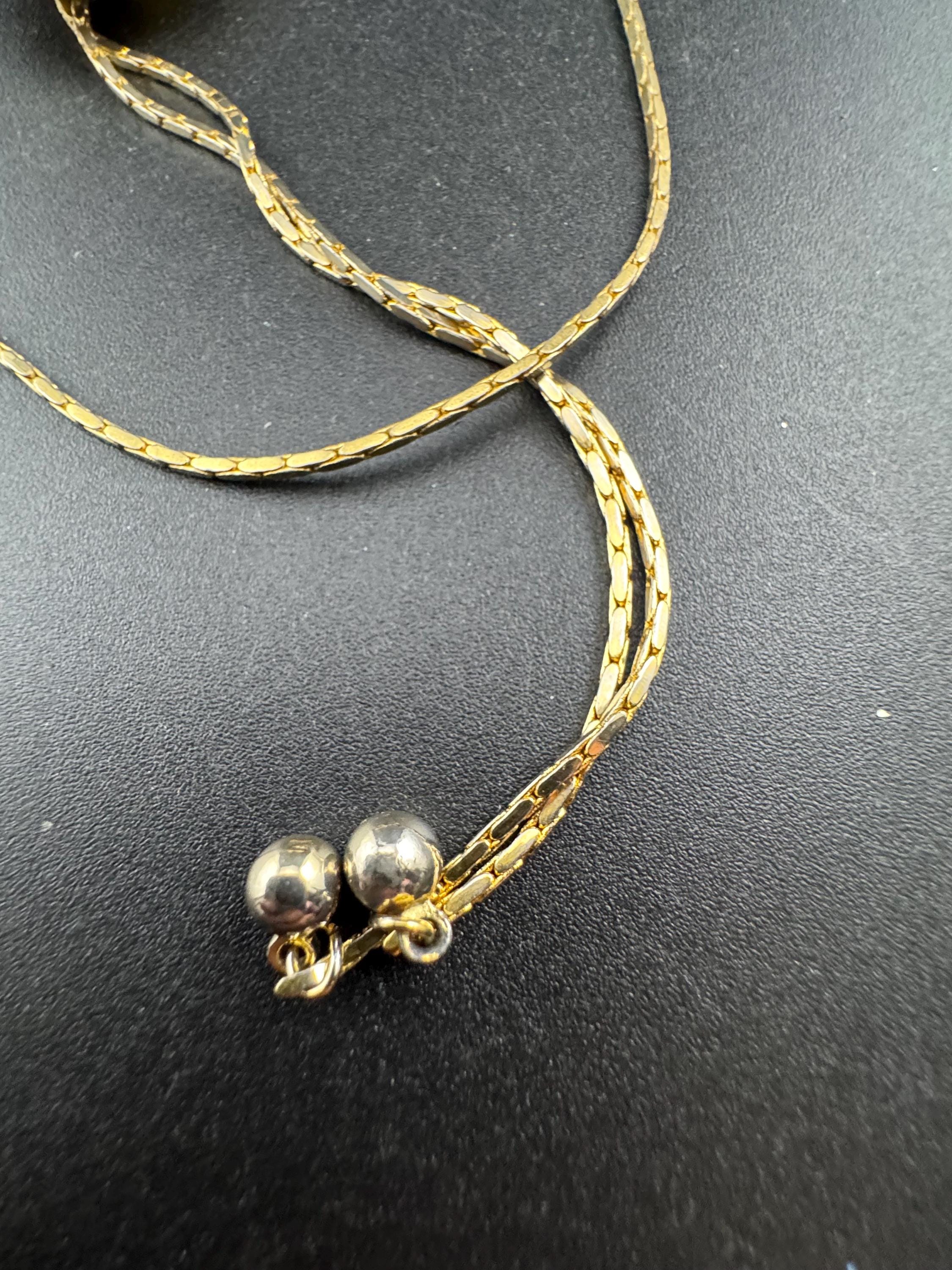 Vintage black enamel and crystal floral slider bolo necklace, with pat no , gold plated