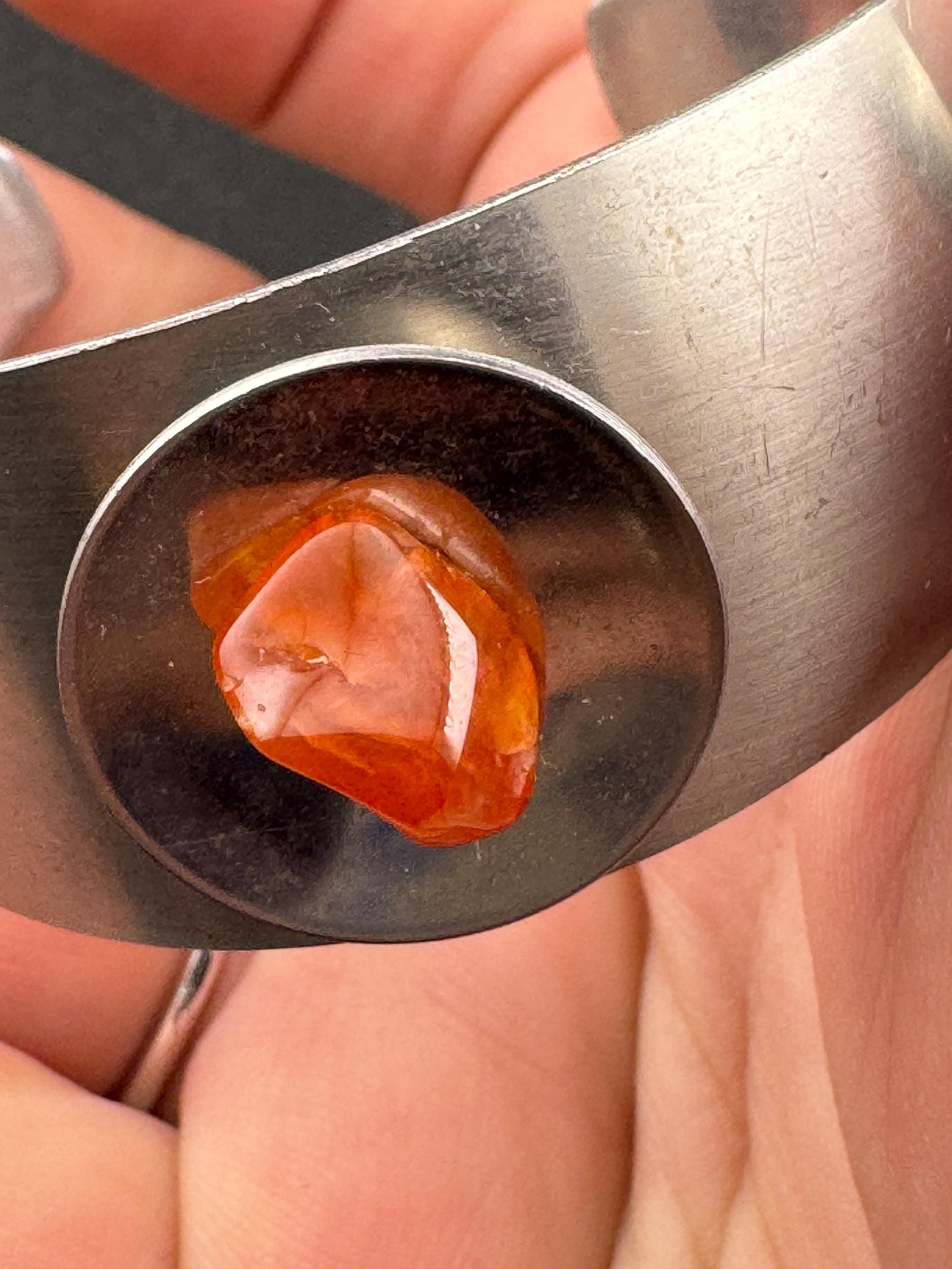 1970s stainless steel wide bangle, set with orange agate genstone