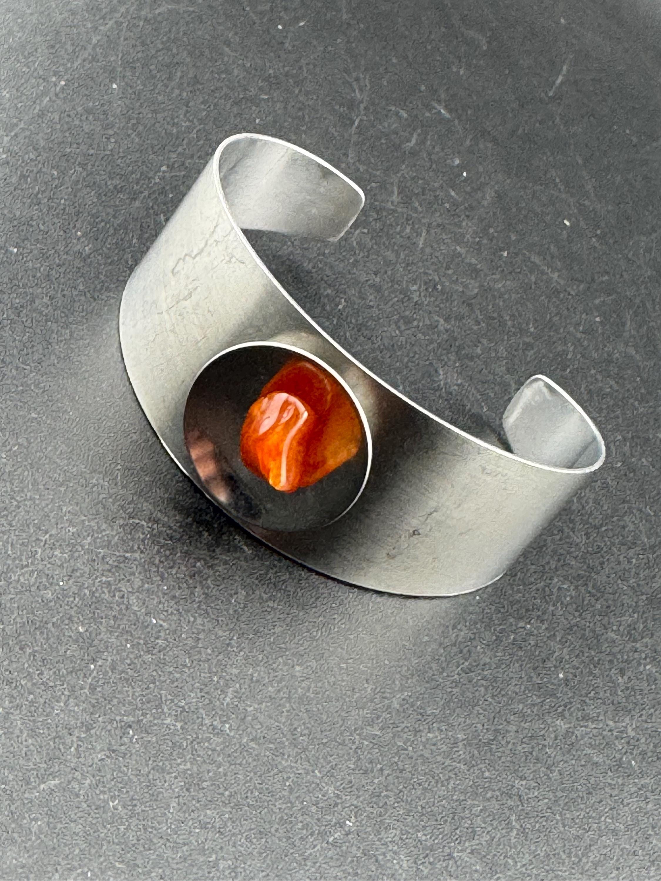 1970s stainless steel wide bangle, set with orange agate genstone
