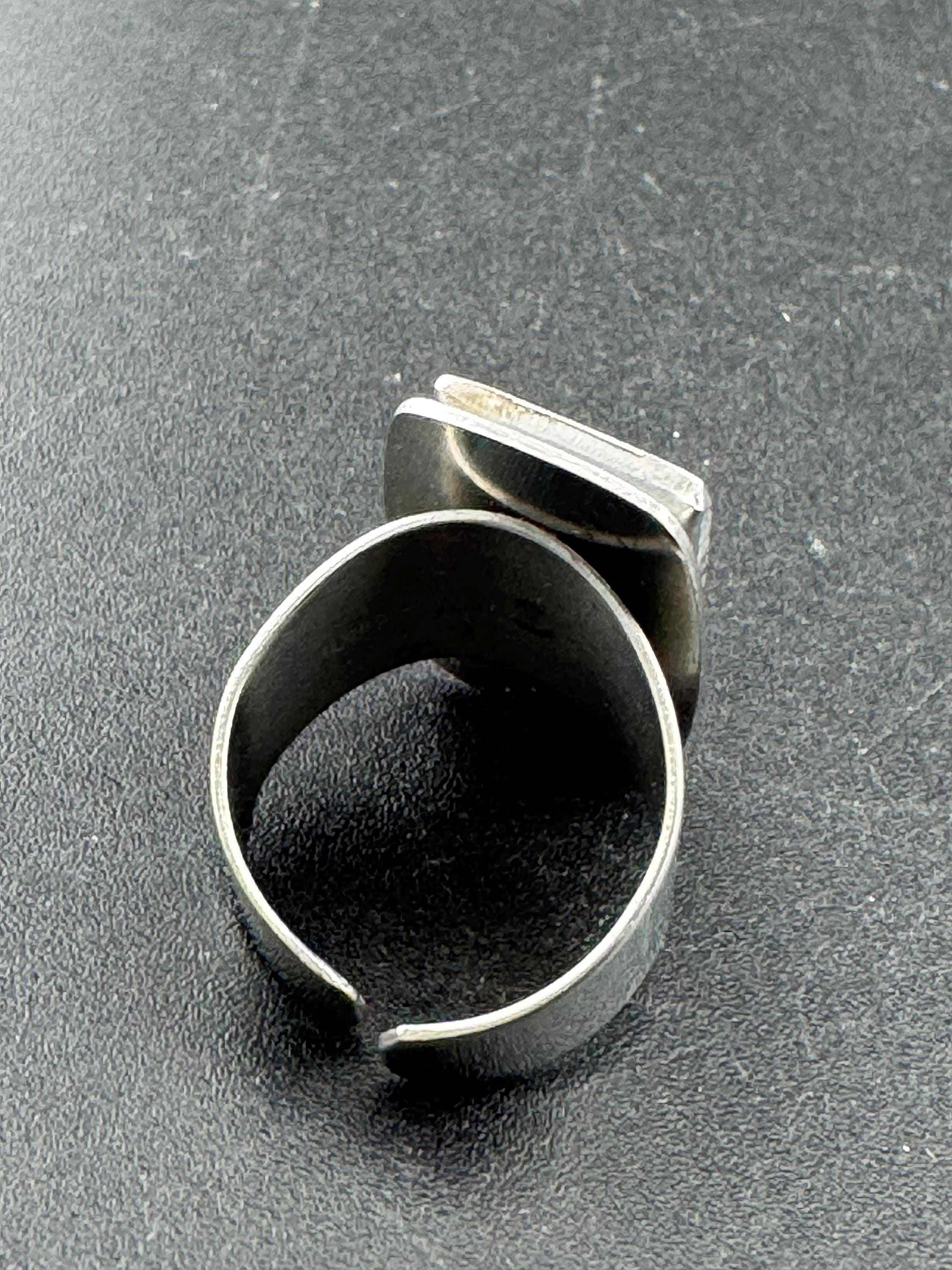 1970s Lord python stainless steel adjustable ring, set with pink shell cabochon, vintage