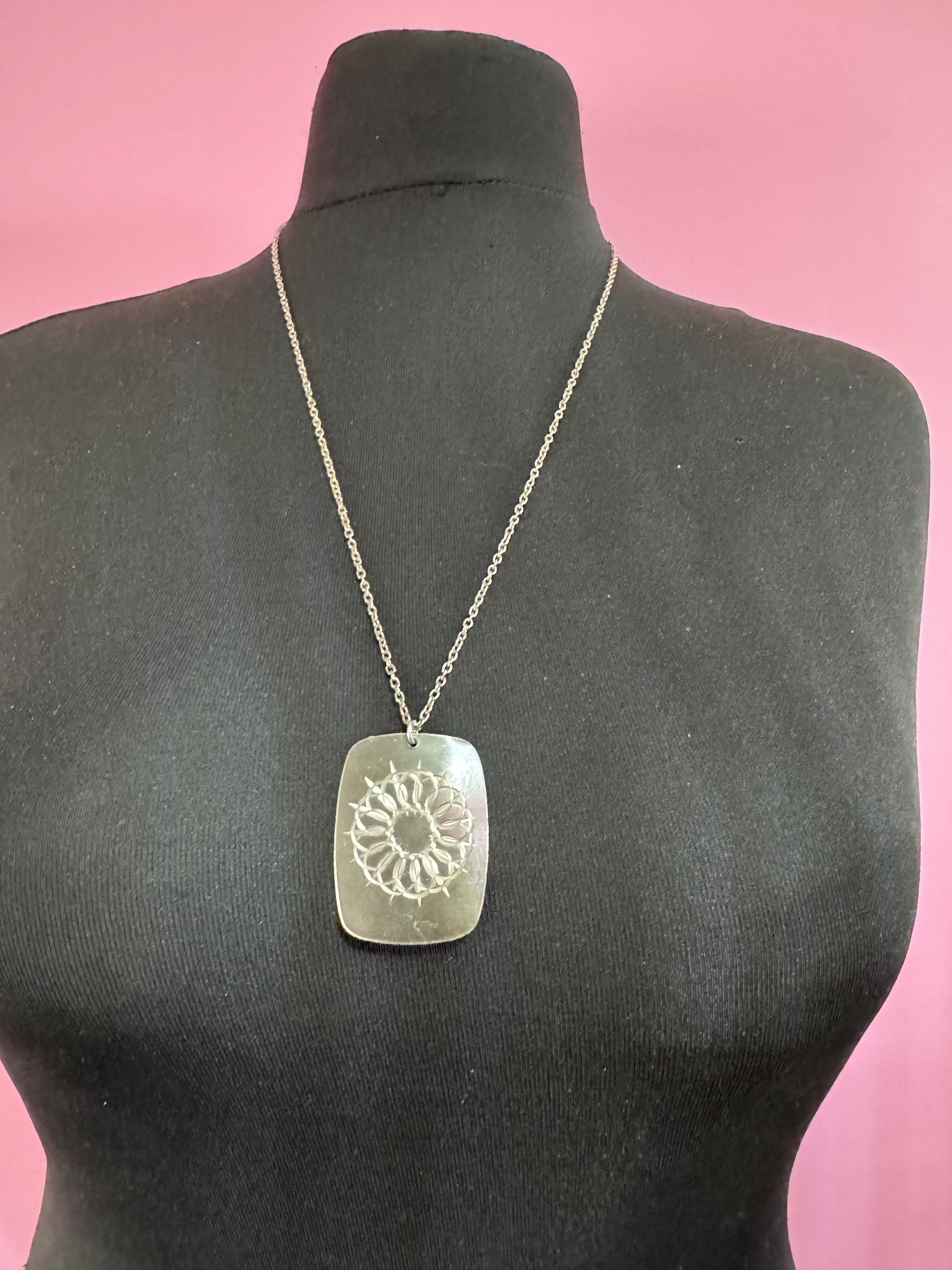 Vintage 1970s stainless steel etched pendant on a 68cm chain