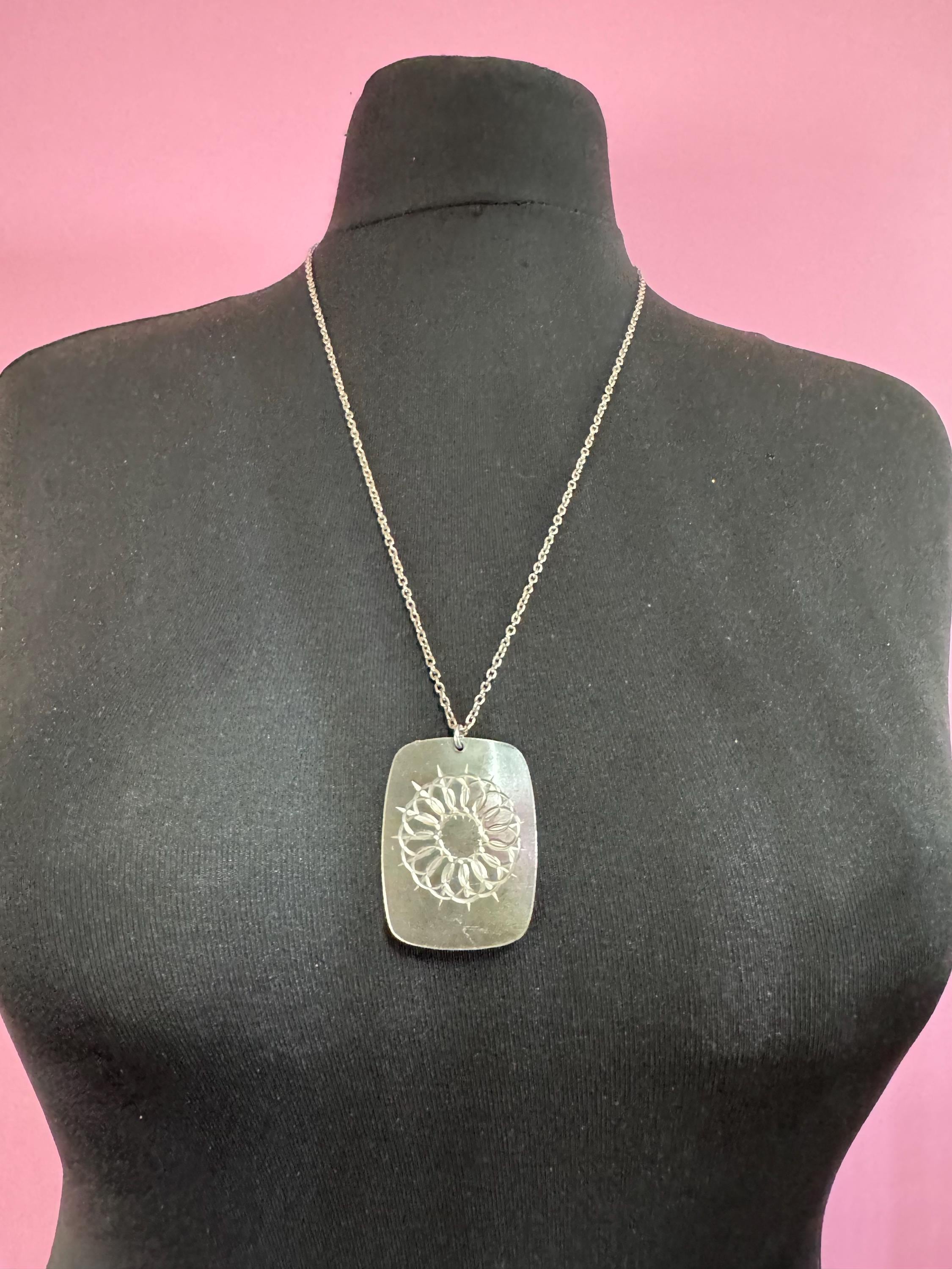 Vintage 1970s stainless steel etched pendant on a 68cm chain