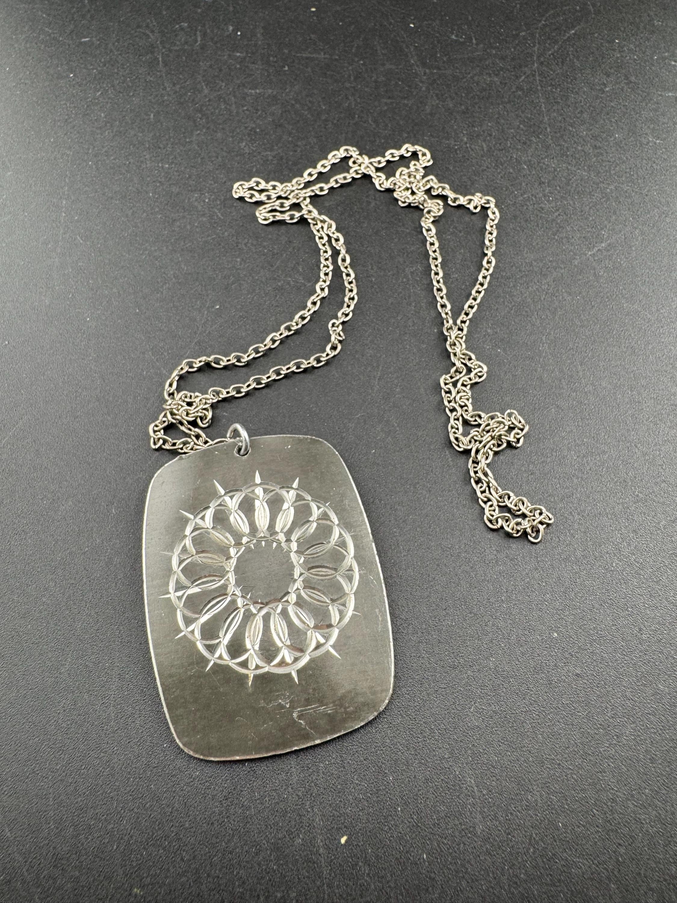 Vintage 1970s stainless steel etched pendant on a 68cm chain