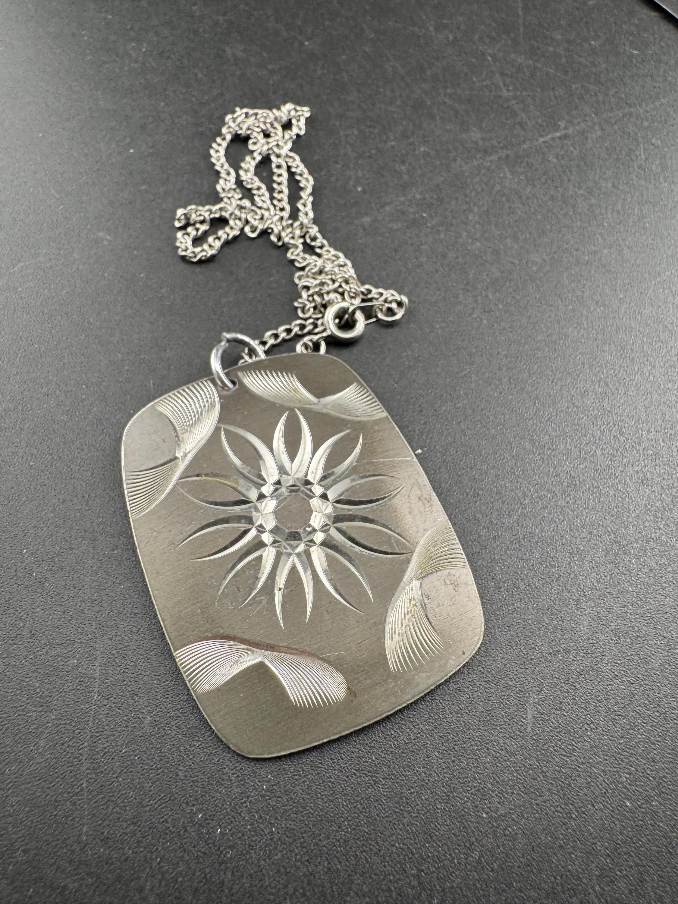 Vintage 1970s stainless steel etched pendant on a 41cm chain