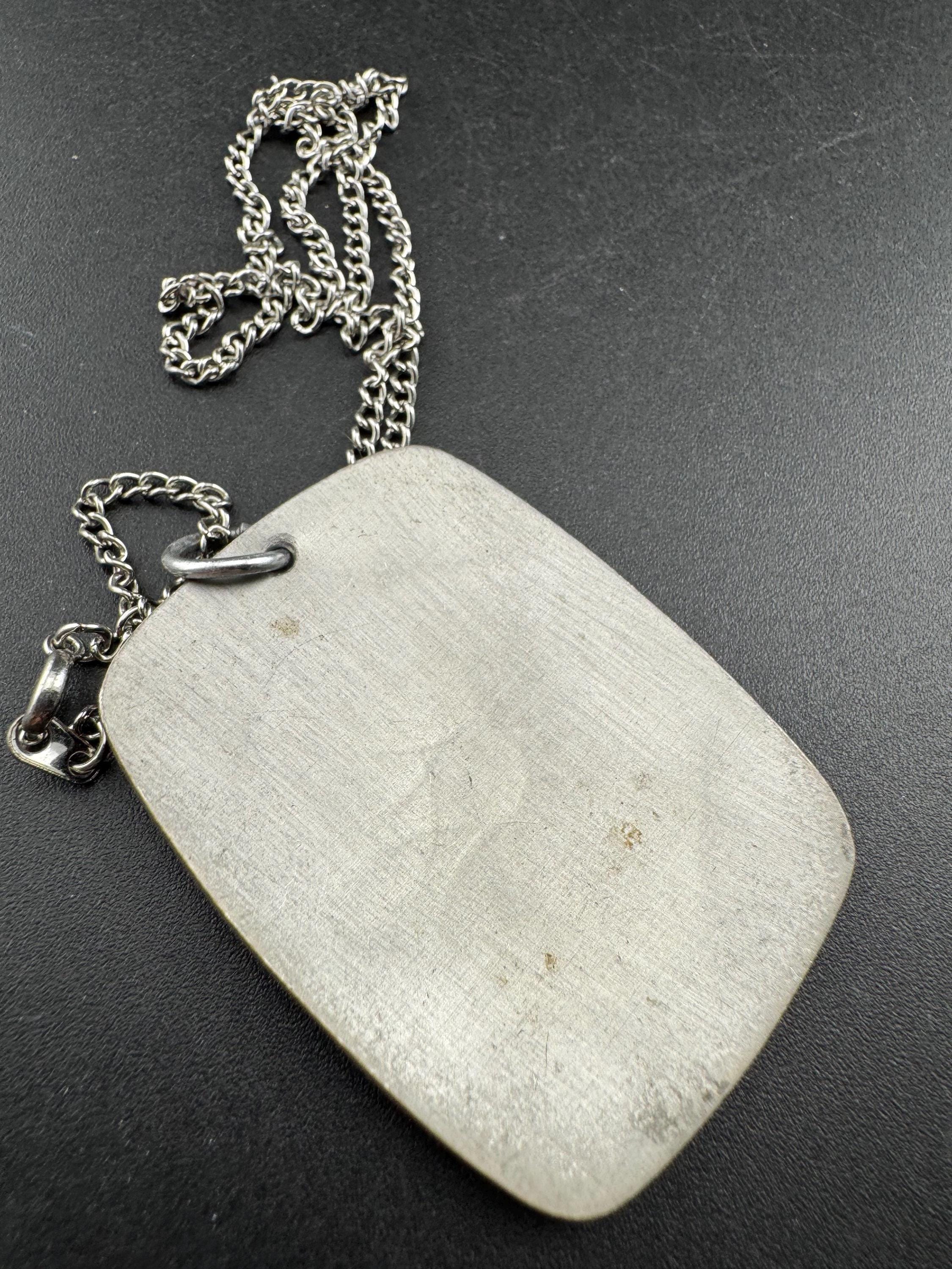 Vintage 1970s stainless steel etched pendant on a 41cm chain