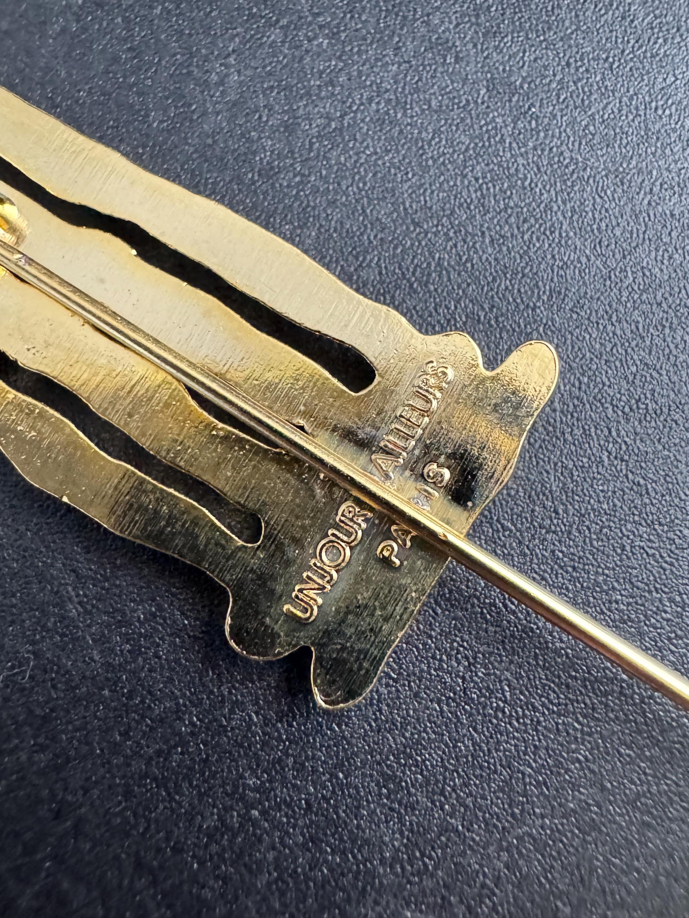 Vintage Un Jour Ailleurs Hat Pin: Gold plated Pillar Brooch  from Paris