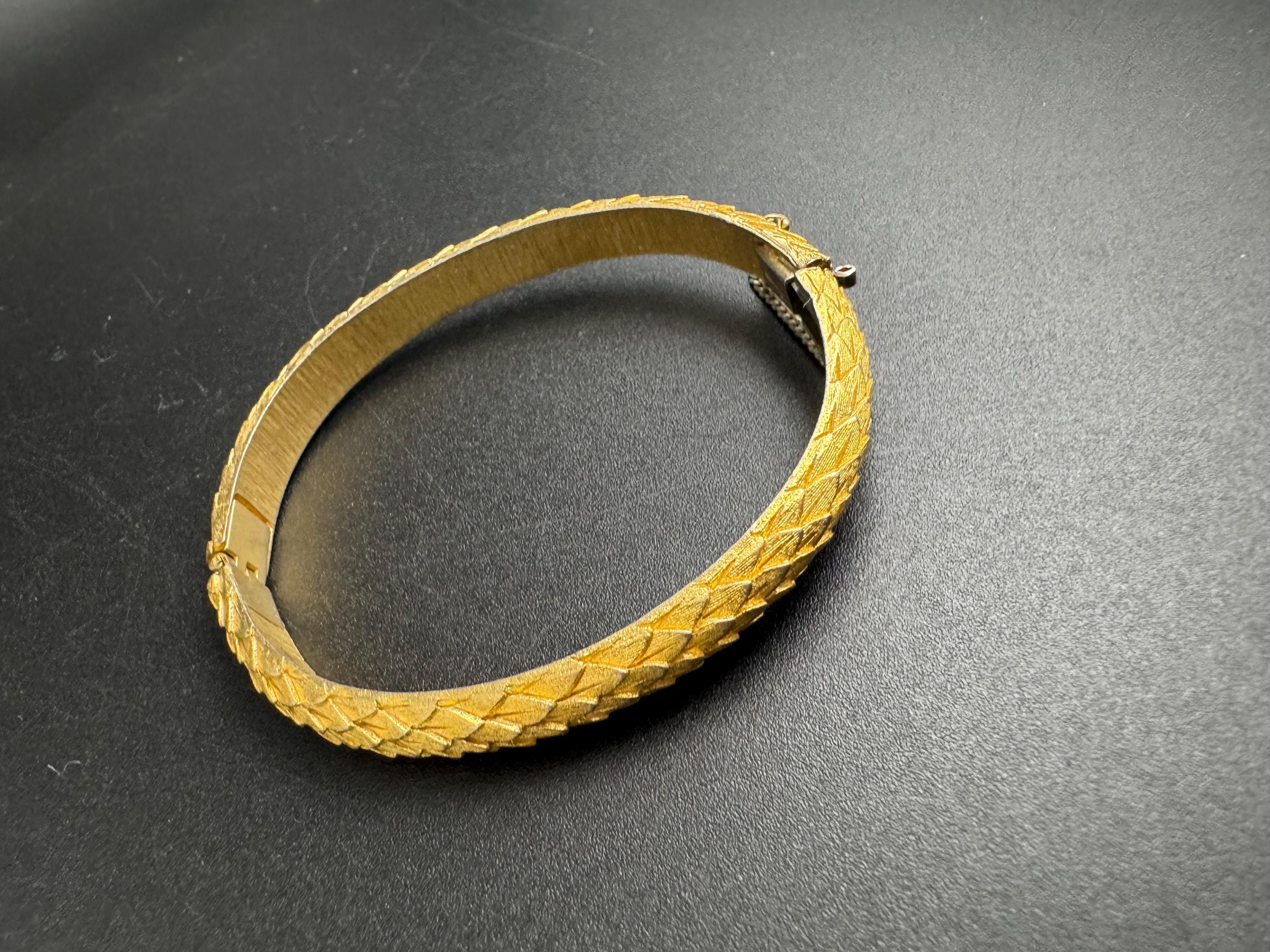 Crown Trifari gold-tone hinged bangle bracelet, textured snake or fish scale pattern