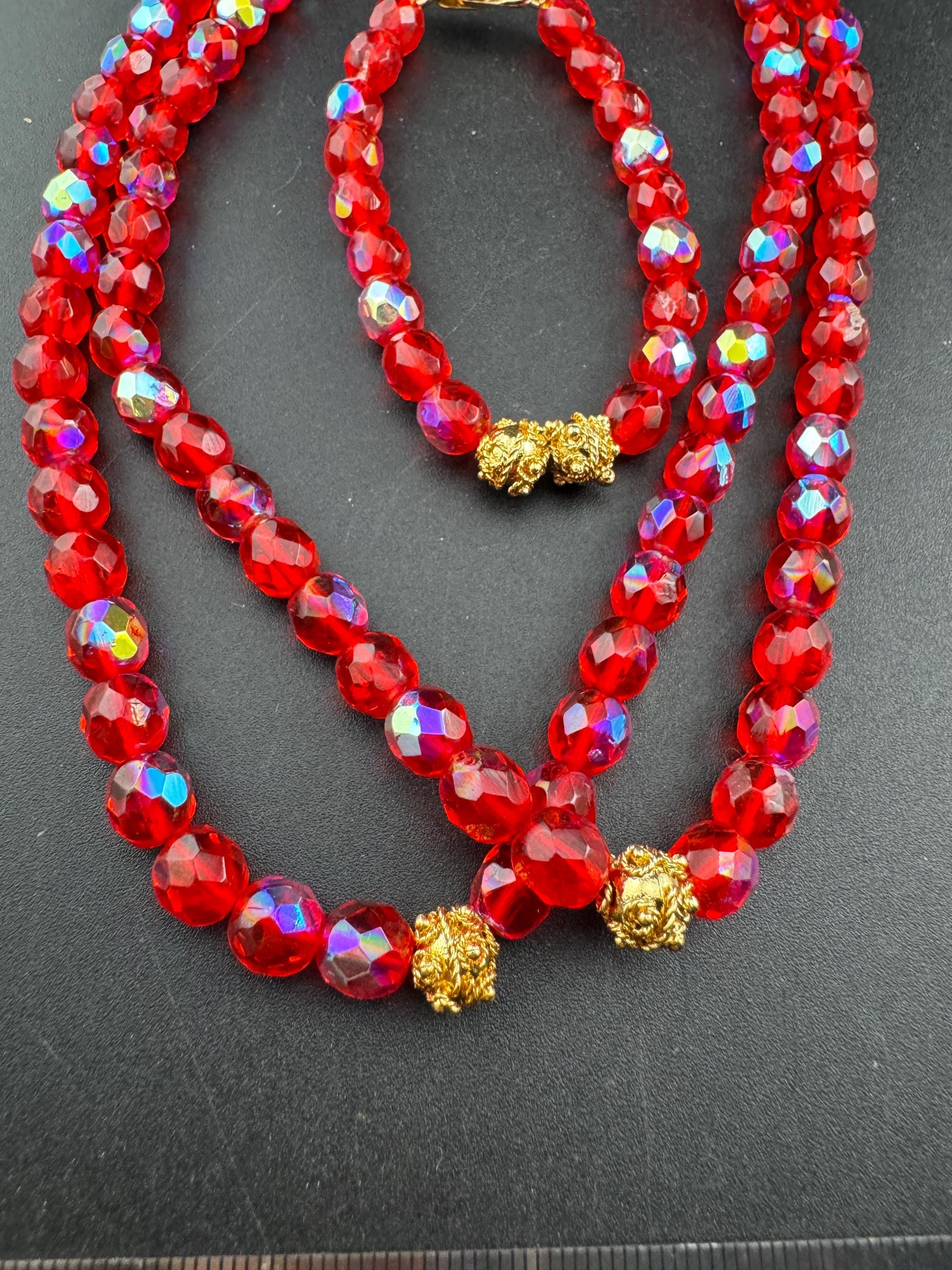 Red glass beaded crystal Multistrand  necklace and matching bracelet, faceted beads gold tone