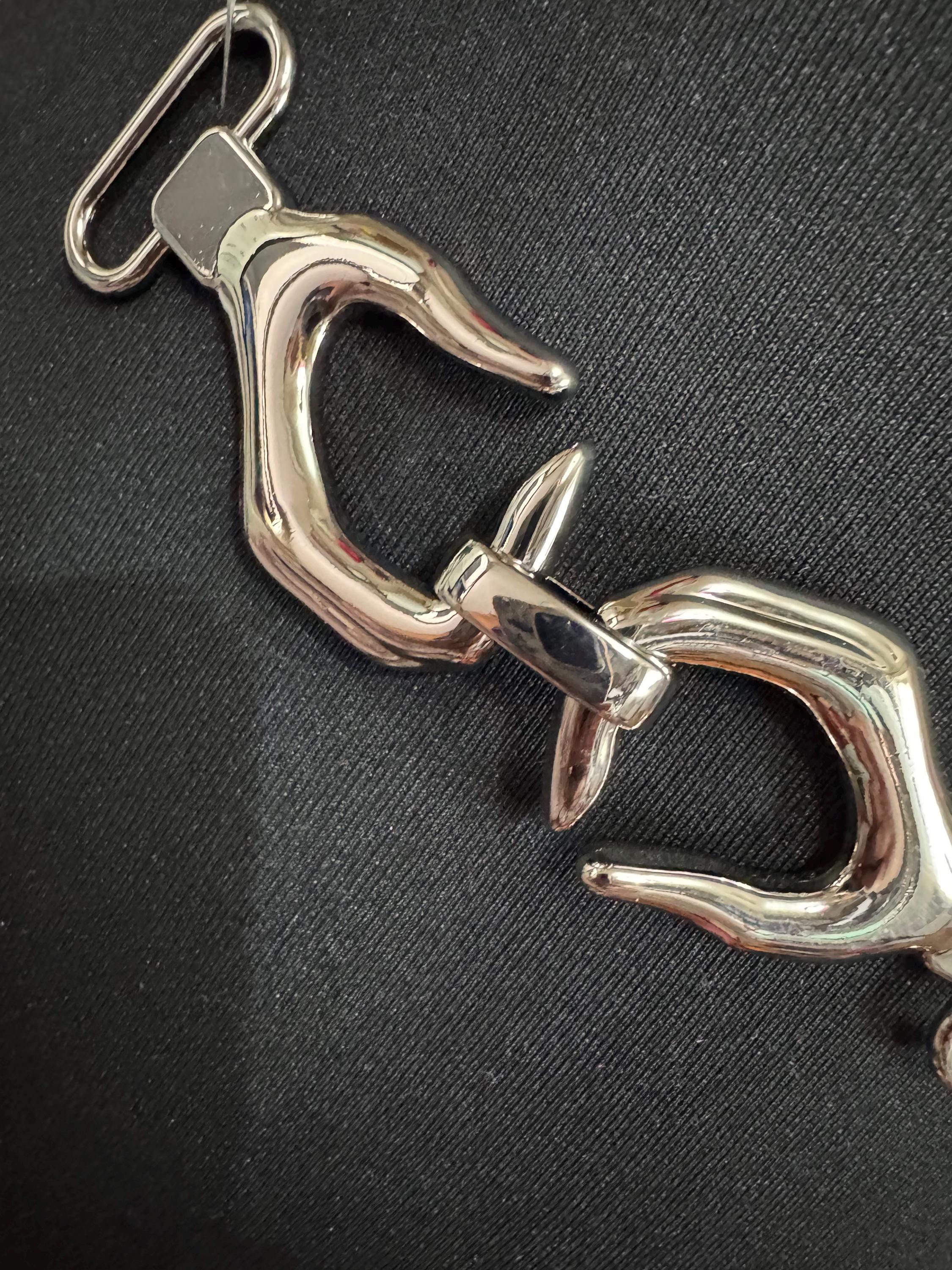 Novelty hand belt buckle, gold and silver tone 13cm