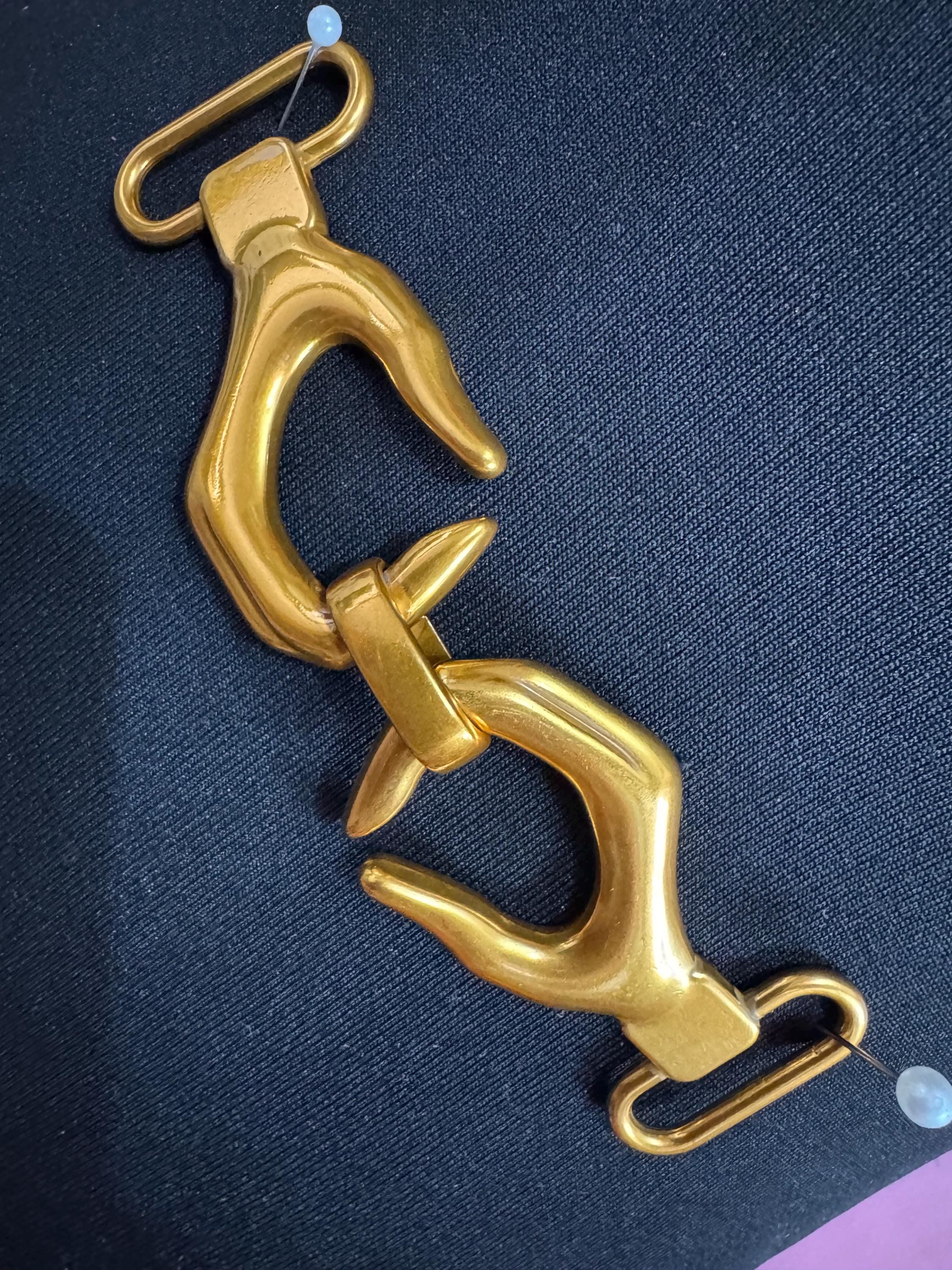 Novelty hand belt buckle, gold and silver tone 13cm