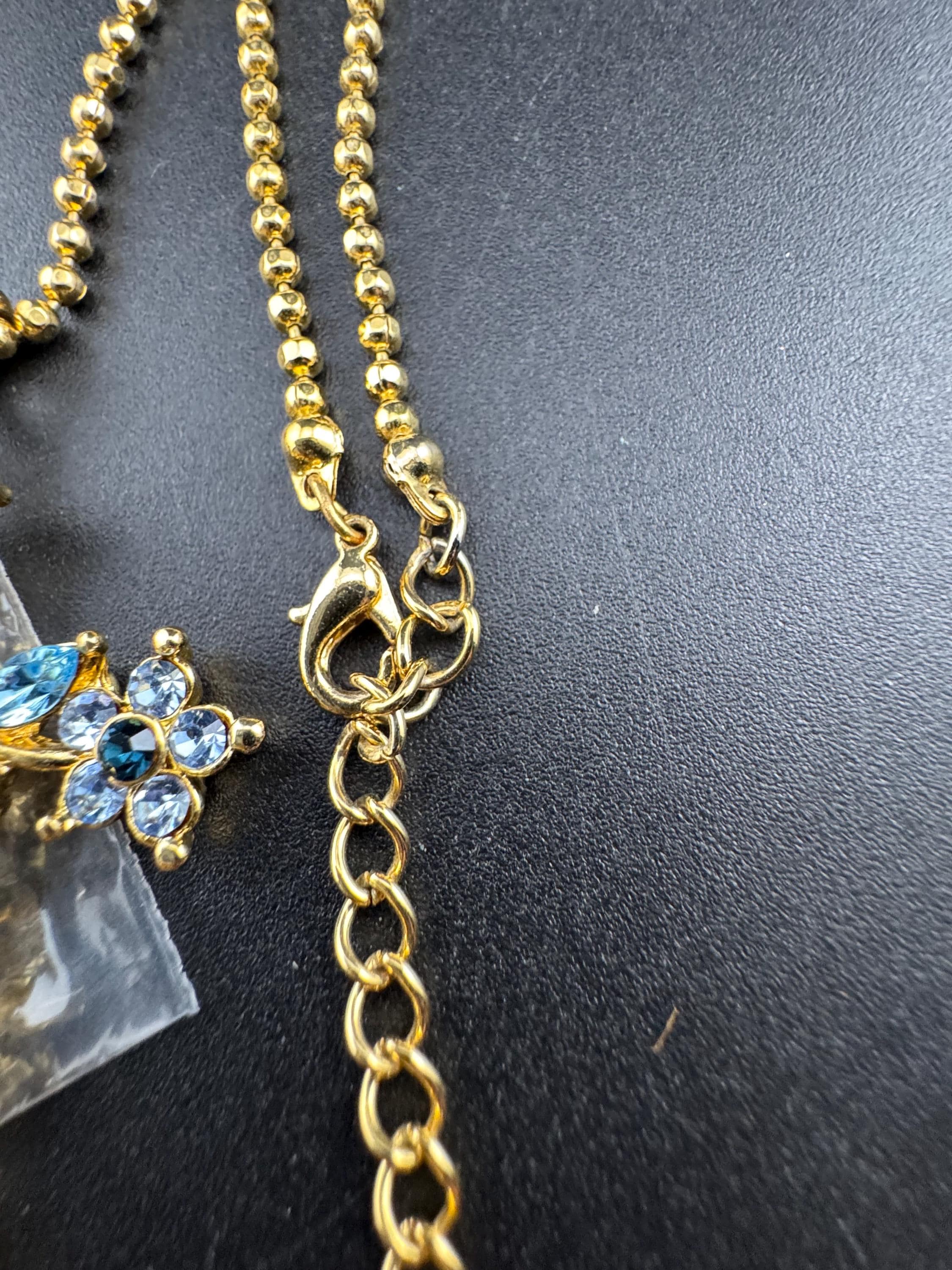 Suzanne Bjontegatd coloured  rhinestone cross pendant on gold tone ball chain